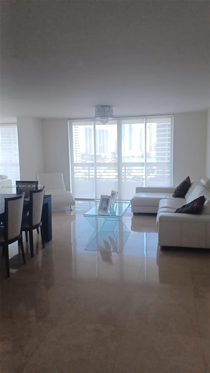 Stunning unit located in Tower 400 of Mystic Pointe, offering breathtaking views. This residence features elegant marble flooring throughout, along with a modern, fully renovated kitchen and updated bathrooms.