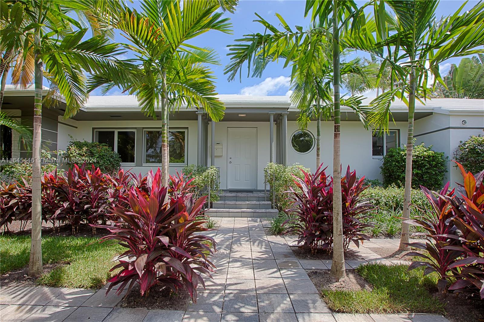 In the heart of Miami Beach's Venetian Islands, discover a serene oasis nestled in a quiet, picturesque neighborhood. This expansive residence offers an open-concept design, where the kitchen seamlessly blends into the living spaces, creating a flow that is both inviting and modern. The kitchen itself is a culinary dream, featuring state-of-the-art stainless steel appliances and sleek finishes. The elegance of wood floors stretches throughout the home, guiding you to the custom-built closets that offer both luxury and practicality. Natural light pours in through hurricane impact windows, illuminating every corner. Step outside to your private retreat—a heated pool surrounded by lush tropical landscaping, perfect for both relaxation and entertaining.