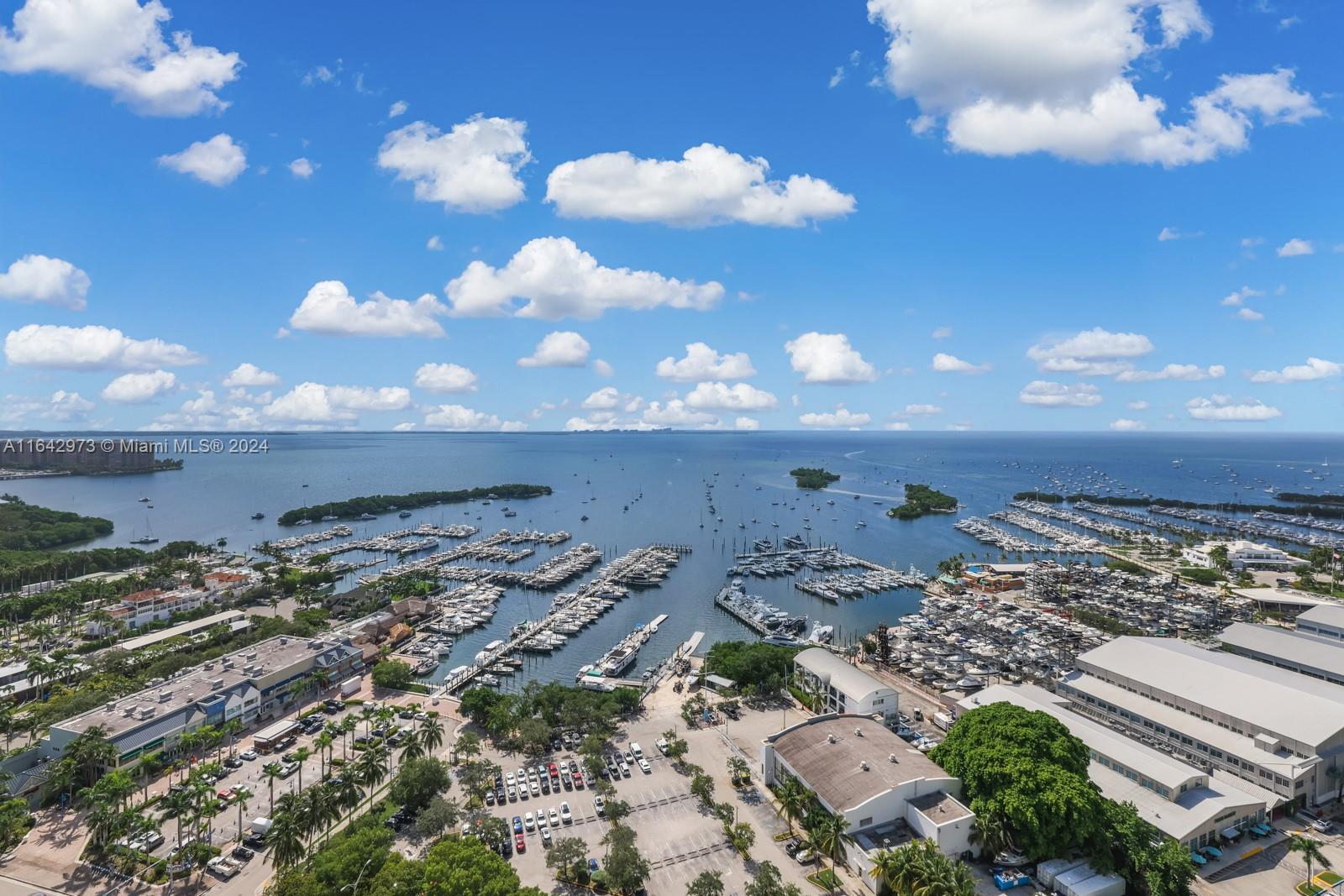 Experience luxury living in this Lower PENTHOUSE residence in the renowned Grovenor House in Coconut Grove! This massive half-floor sky-home boasts endless panoramic Bay & skyline views & has 2K SF of terrace space. A private elevator brings you to a private foyer that opens up to an expansive formal living room w/ 13' ceilings & mesmerizing Bay views. Featuring marble & wood floors throughout, the design is truly timeless & elegant. The chef's kitchen boasts top-of-the-line appliances & massive island. The primary suite features his & hers spa-like baths & massive custom walk-in closet. Additional highlights include a staff quarters, gym, office, 3 assigned parking spaces, & 1 storage unit. Perfectly positioned within walking distance to the best schools & dining in Miami.