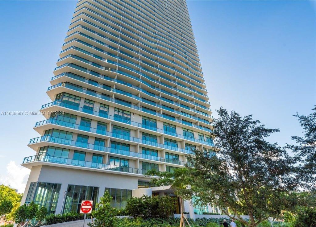 This stunning 2-bedroom, 2-bathroom residence offers breathtaking views of Midtown and Wynwood. It features hurricane-impact, floor-to-ceiling windows and doors, a convenient split floor plan, a designer kitchen, modern flooring, an in-unit washer and dryer, a balcony, and parking. Located in the luxurious Paraiso Bayviews, a 43-story condo tower in the bayfront neighborhood of Edgewater, this building boasts top-tier amenities, including a rooftop pool, sunset pool, tennis and paddle courts, BBQ areas, a club room, kids' room, billiards room, theater, fitness center, spa, 24-hour valet parking, and 24-hour concierge service.