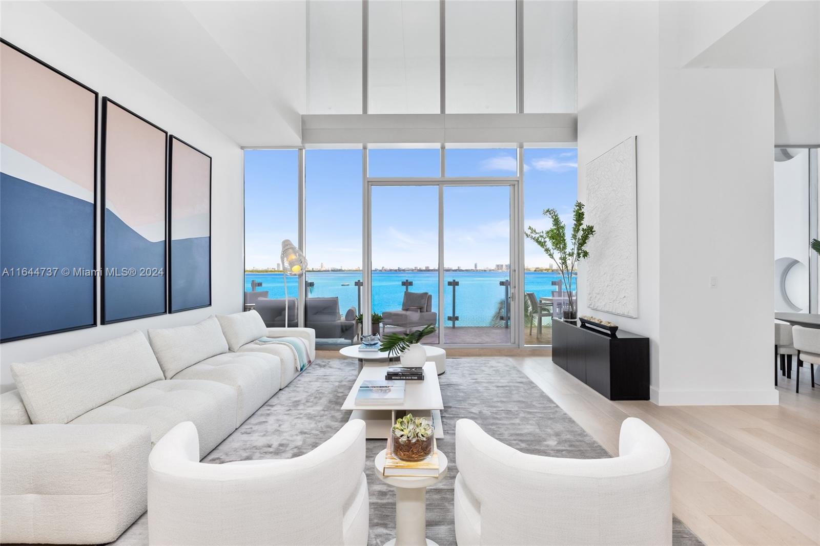 Introducing this breathtaking 2-story unit at Missoni Baia in Edgewater. This "House in the Sky" offers unobstructed, direct bay & ocean views and boasts a rare floor plan... 1 of only 3 in the entire building. Enter through your private elevator entrance foyer directly into the unit where you'll find 6 beds, 6.5 baths spanning 4,345 interior sqft, double-height ceilings, spacious living areas, ample storage, an oversized balcony, and floor-to-ceiling windows. Additional features include a gourmet kitchen with Sub-Zero and Wolf appliances, Italkraft cabinetry, marble countertops, glass staircase, and wooden floors.  Top-notch building amenities include a state-of-the-art fitness center, three pools, a tennis court, BBQ area, kid's playroom, sauna/spa, and more. Materport & video available.