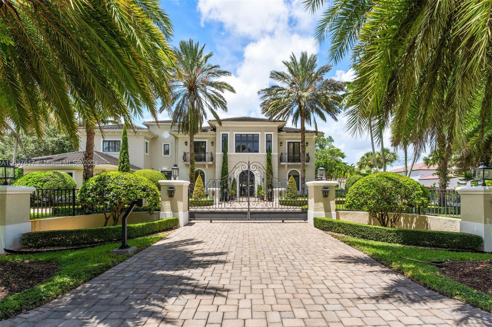 On a quiet tree-lined street in Pinecrest, this meticulously crafted and elegantly appointed 9,567 SF residence, with 7-BD, 6-BA,and 2-HB on a sprawling 36,590 SF lot, is entered through an impressive grand foyer with triple-height volume ceilings, leading to multiple wine cellars, wet bar, movie theatre, and game room. A chef’s kitchen offers an expansive center island, premium appliances, and pantry. Additional features include an elevator, generator, Savant smart system for lighting, audio and security, impact windows/doors, and insulated 3-car garage with AC. Outdoor entertainment areas include a covered terrace with summer kitchen, sparkling saltwater pool, jacuzzi and tennis/soccer/basketball court. A detached cabana includes a half bath, custom bar, and recreation room.