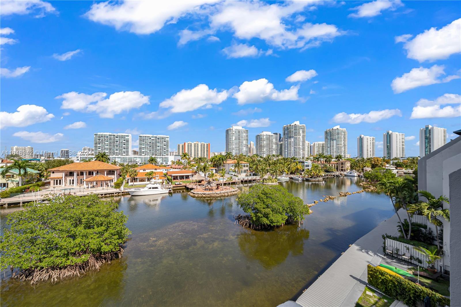 The most sought after private waterfront community in Sunny Isles . Poinciana Island Yacht and Racquet Club has many amenities that are no longer built in today's market . This spacious two story unit has a designer kitchen , flooring and bathrooms with an amazing open floor plan . Outrageous over sized balconies so you are living the dream of indoor and outdoor living all year round