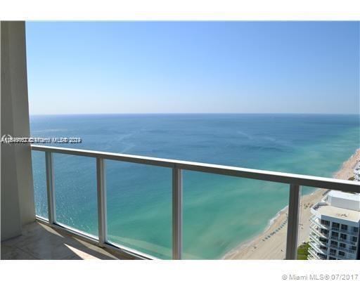 Breathtaking ocean views condo and city views from every room!! 2/2 split layout, all laminate wood floors throughout the unit, best south east views!!! Open kitchen, enjoy all building amenities heated pool, beach service, valet parking service, kids room and more!! Great location, walking distance to shops and restaurants.