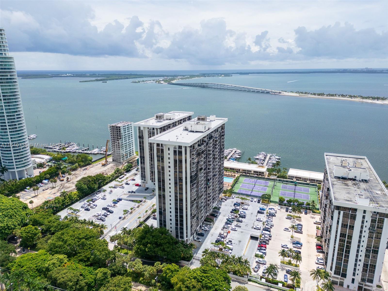 2-bedroom condo at Brickell Place, complete with coveted underground parking. Revel in unparalleled amenities including 2 pools, 6 tennis courts, a state-of-the-art Health and Fitness Center, BBQ areas, and Indoor/Outdoor Children's Play Areas. Indulge in the luxury of new appliances, a renovated kitchen, renovated bathrooms, and built-in closets, ensuring both style and functionality. With a washer and dryer conveniently located inside, every aspect of convenience is at your fingertips. Marvel at the breathtaking views of both the bay and the city from every room, offering a stunning backdrop to your daily life. Whether you prefer a furnished sanctuary or a blank canvas to personalize, this unit offers the flexibility to suit your lifestyle.