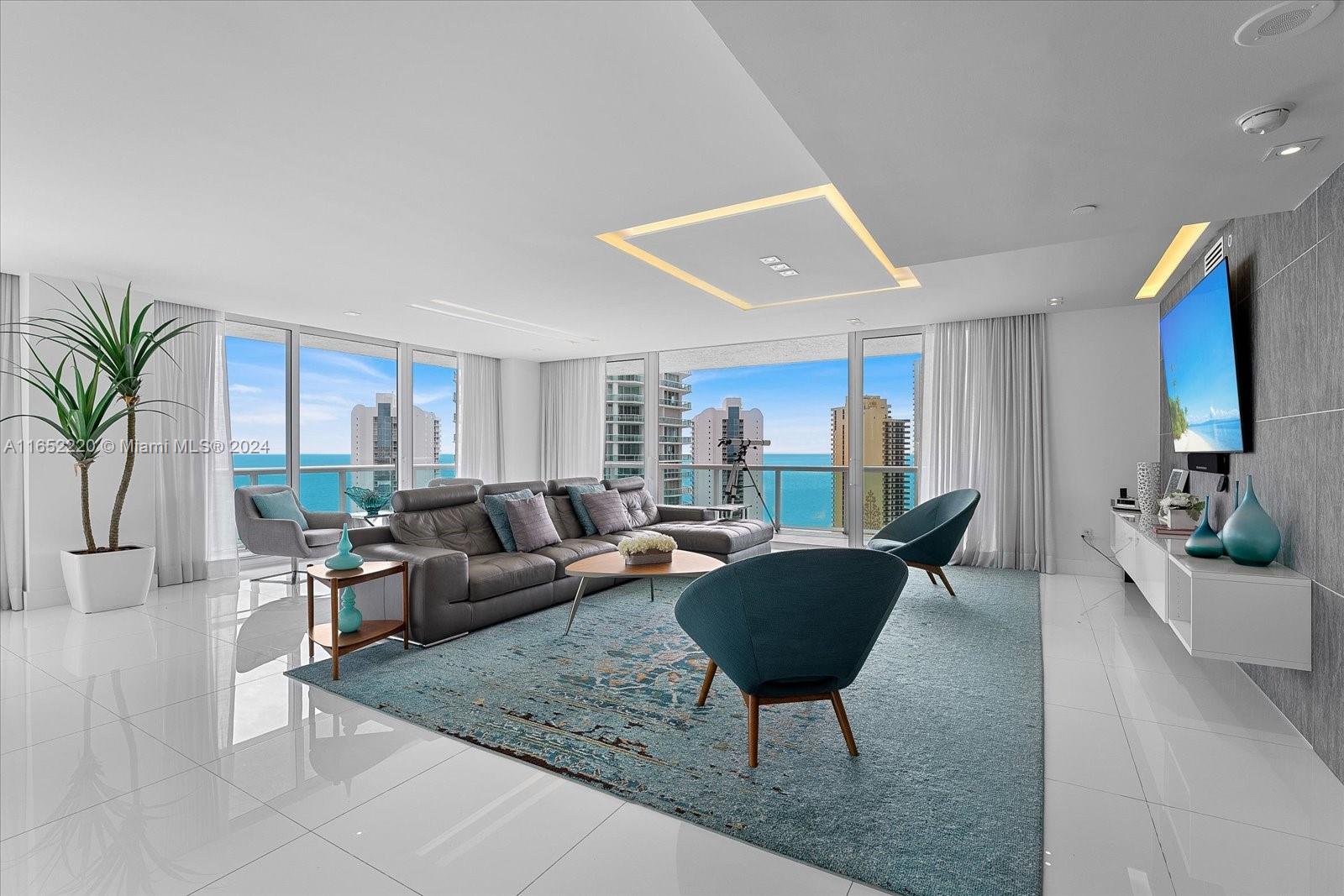 REPRICED! Luxury living in this fully remodeled, fully furnished 2 bed / 3 bath with 2,144 sq ft in Sunny Isles, Florida. Designed w no expense spared, turn-key. Wrap-around balcony only offered on top floors. Sophisticated open-concept layout w high-end finishes and stylish decor w floor-to-ceiling windows, unobstructed views of the ocean, open bay, & downtown Miami skyline. Hurricane proof windows replaced in the unit.
Gourmet kitchen, top-of-the-line appliances, custom cabinetry & countertops. Two spacious bedrooms designed and en-suite bath.
Unit can be converted into a 3-bed layout to suit your needs. TWO ASSIGNED self-parking spaces.
5-star amenities w private beach club, tennis courts, state of the art gym, squash, spa, restaurant & more. Don’t miss the opportunity.