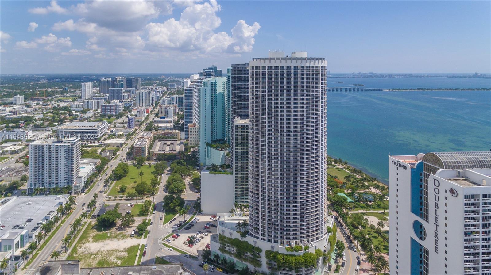 Welcome to luxury living at Opera Tower in Miami's vibrant Edgewater neighborhood. This 1-bedroom, 1-bathroom unit offers stunning views of Biscayne Bay and the city from its spacious balcony. Enjoy high-end finishes, including floor-to-ceiling glass windows, granite countertops, and stainless steel appliances. The building's amenities feature a state-of-the-art fitness center, a swimming pool, whirlpool spas, and a 24-hour concierge. Conveniently located near Margaret Pace Park, shops, and restaurants,  walking distance from Publix, Opera and Art District with stunning views. This condo is a perfect urban retreat.