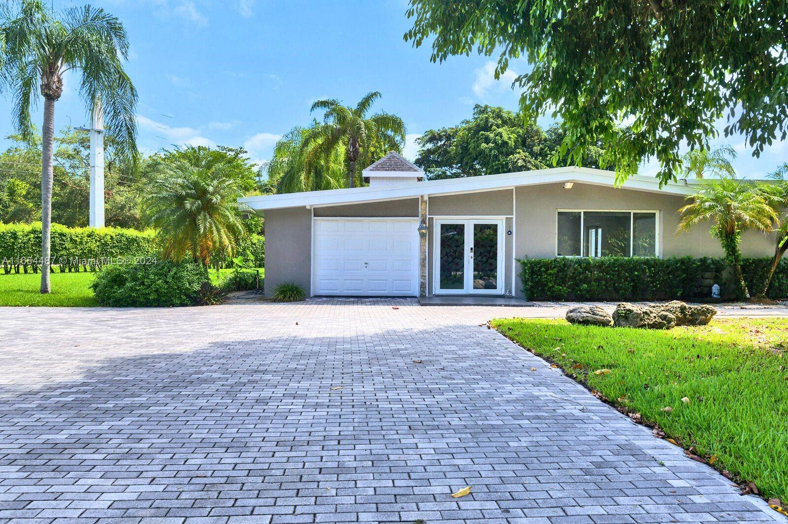 Modern and spacious 4-bed, 2-bath Pinecrest pool home available for sale in one of Miami's most desirable neighborhoods, known for its top-rated schools and family-friendly atmosphere. This home features high-impact French doors, recessed lighting, and sleek tile flooring throughout. Enjoy a stylish kitchen with quartz countertops and a waterfall island. The large corner lot, over half an acre, is perfect for outdoor entertaining with a basketball court, pool, and terrace. Plus, there's a bonus room by the pool, a one-car garage, and ample space for a boat or RV. Currently tenant-occupied until December 15, 2024.