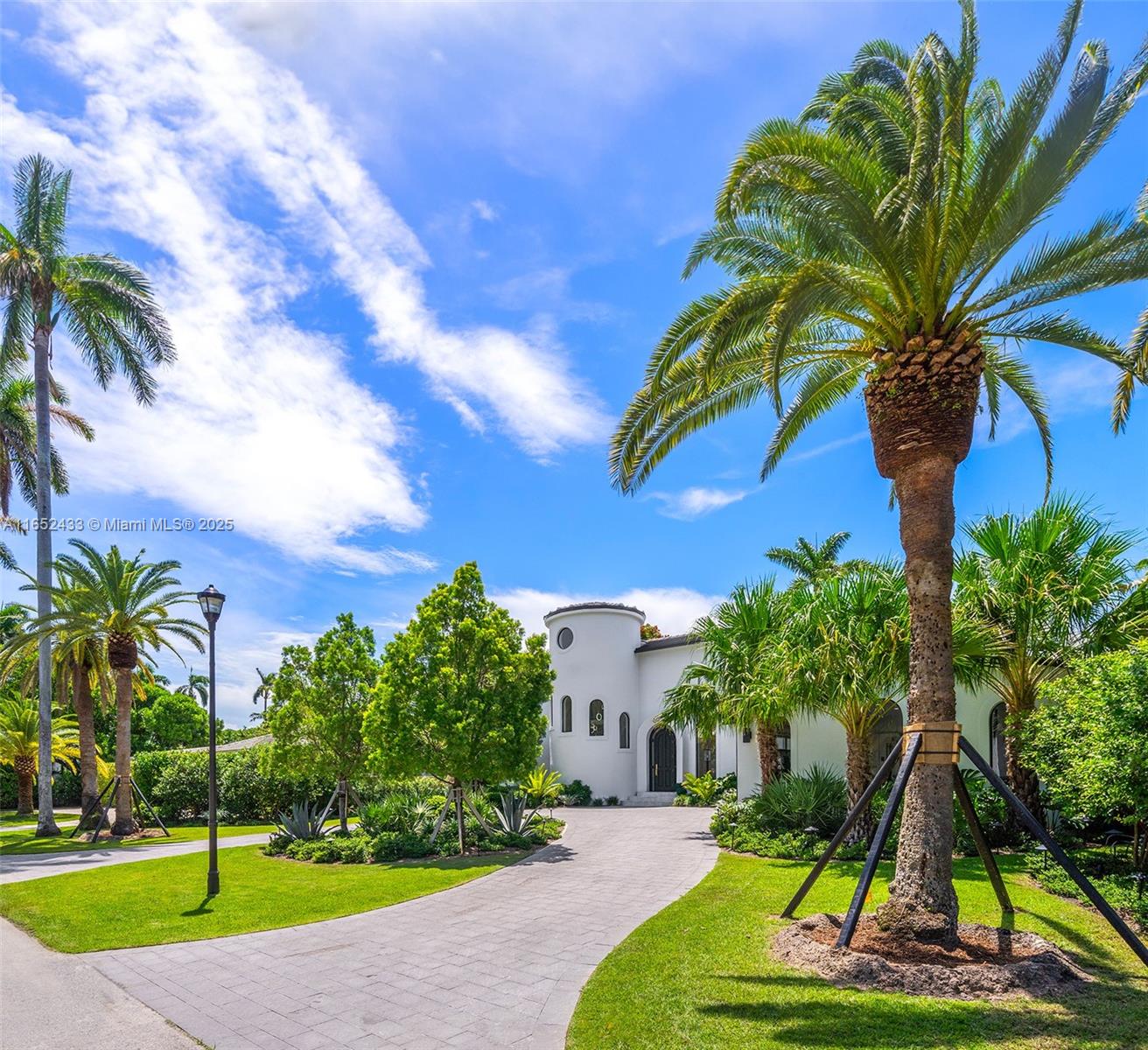 Stunning, fully remodeled luxury home on exclusive and gated La Gorce Island. This masterpiece was meticulously updated and expanded in 2023 using the finest materials and finishes, ensuring an exceptional living experience. Beautiful transitional-style exterior with immaculately manicured landscape and circular driveway creates a grand entrance that sets the tone for what lies within. Inside this sophisticated residence, living room with soaring ceilings is the centerpiece of the home - surrounded with an Italkraft kitchen, elegant dining room, powder room, and garage transformed into a gym. Finishes include wood flooring, marble kitchen countertops, marble staircase, RH baths. Enjoy Miami’s year-long summers outside your backyard with a new pool, pergola, and incredible summer kitchen.