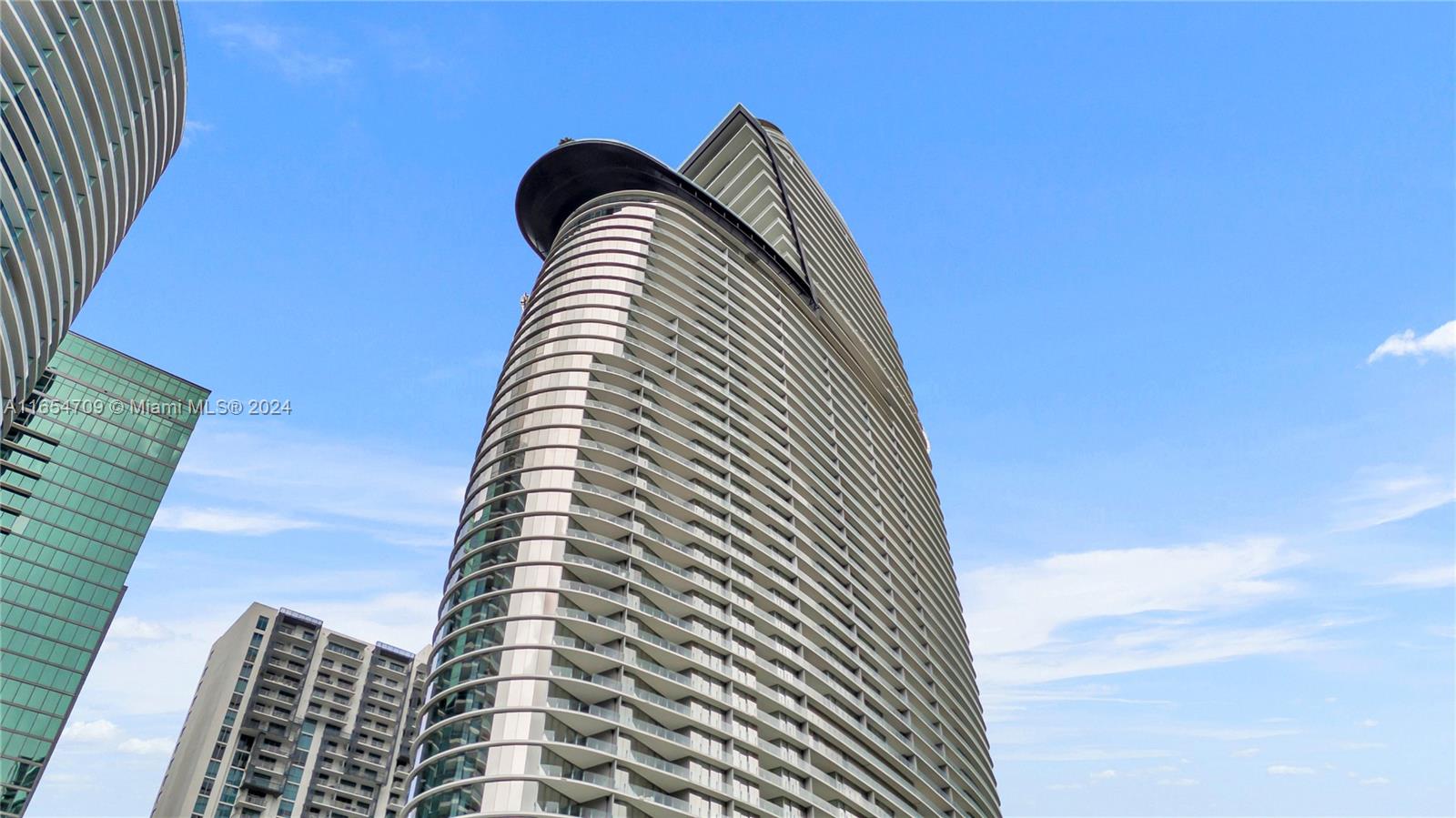 A distinguished 3-bedroom + den, 4.5-bathroom residence on the 42th floor of the newly completed Aston Martin Residences in Downtown Miami. This flow-through unit offers unparalleled vistas, with breathtaking views of Biscayne Bay and the vibrant city skyline. The residence features a meticulously designed kitchen, fully equipped with premium Gaggenau appliances, as well as separate staff quarters with a laundry area and full bathroom. The expansive layout includes a family room, living room, and den, providing ample space for luxury living.

Residents benefit from an exceptional downtown location and have access to an array of world-class amenities, including indoor and outdoor pools, a two-story state-of-the-art fitness center, a spa, golf simulator, art gallery, and much more.