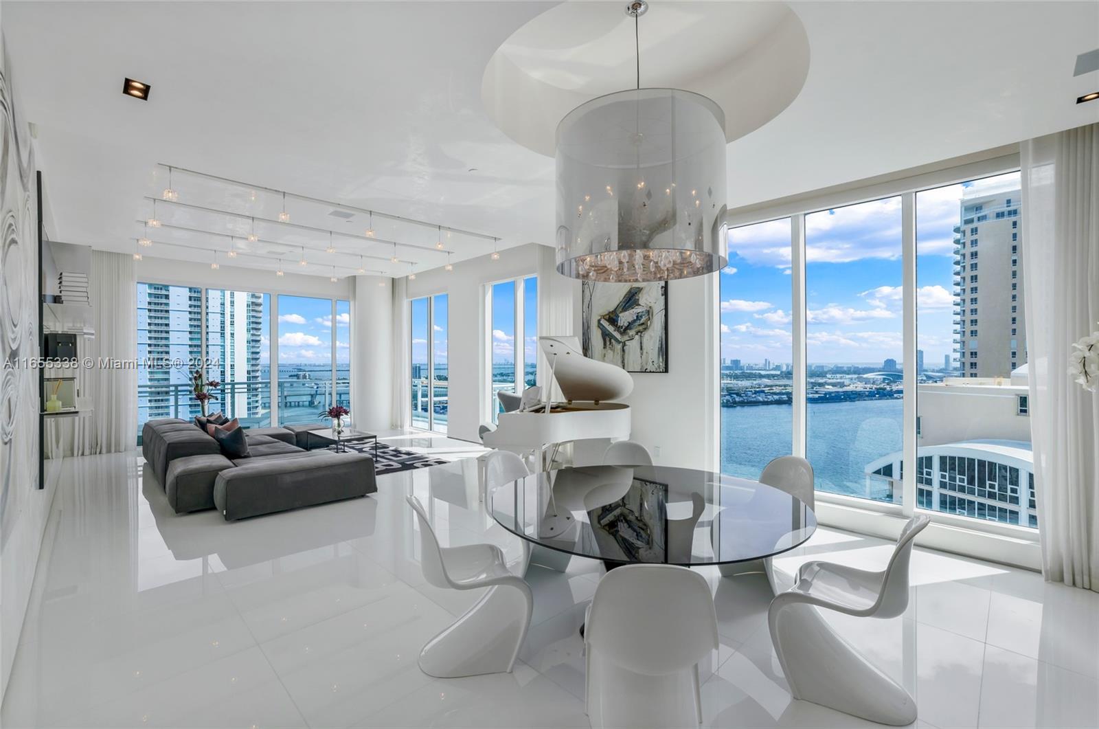 A stunning, high-floor, custom-designed 4 bedroom + office home on Brickell Key, with high-end finishes and with breathtaking views in every direction. Private elevator landing, custom lighting elements, venetian plaster walls and ceilings, two hand-painted murals by a renowned Miami artist, massive architecturally significant entrance door, high-gloss Poggenpohl kitchen, floor-to-ceiling interior doors, museum-style baseboards, European imported bathroom fixtures… this home is a pinnacle of luxury living in Brickell. A true one-of-a-kind home, perfect for entertaining and showcasing your art collection, with stunning Miami and Biscayne Bays as a backdrop. 2 parking spaces and private storage