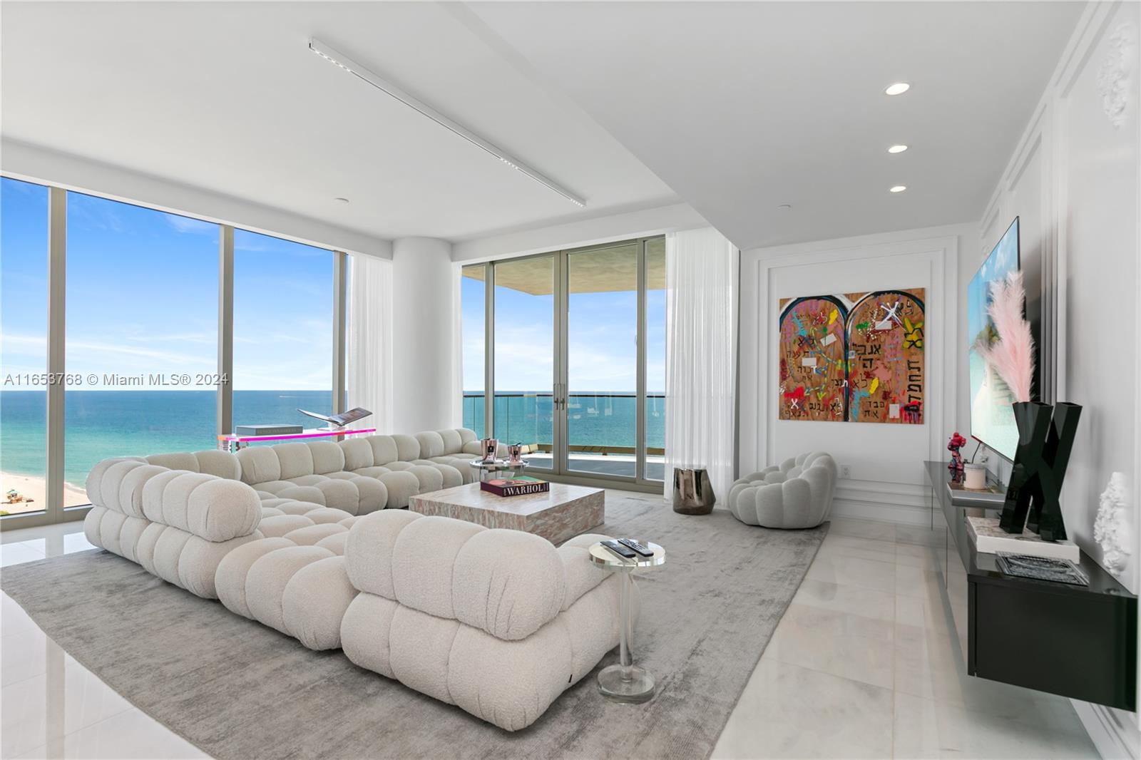 Miami art-deco meets modern luxury at this spectacular true 4-bedroom corner residence! Designed and decorated to the nines with the finest finishes that feature genuine white marble floors, elegant wainscot-walls, onyx primary bathroom overlooking the sea, chef’s kitchen with La Cornue gas range, two expansive terraces complete with outdoor summer kitchen, and complete smart home automation. European furnishings and Baccarat chandeliers are negotiable. The Estates at Acqualina is bar-none, Miami's premier luxury lifestyle property. Services and amenities feature Rolls Royce House Cars, 5 world-class restaurants including Avra, Il Mulino, Keuh, Costa Grill and Toscana, 3 pools with SurfRider/slide, daily breakfast, cinema, skating rink, bowling, F1, golf simulator and basketball court!