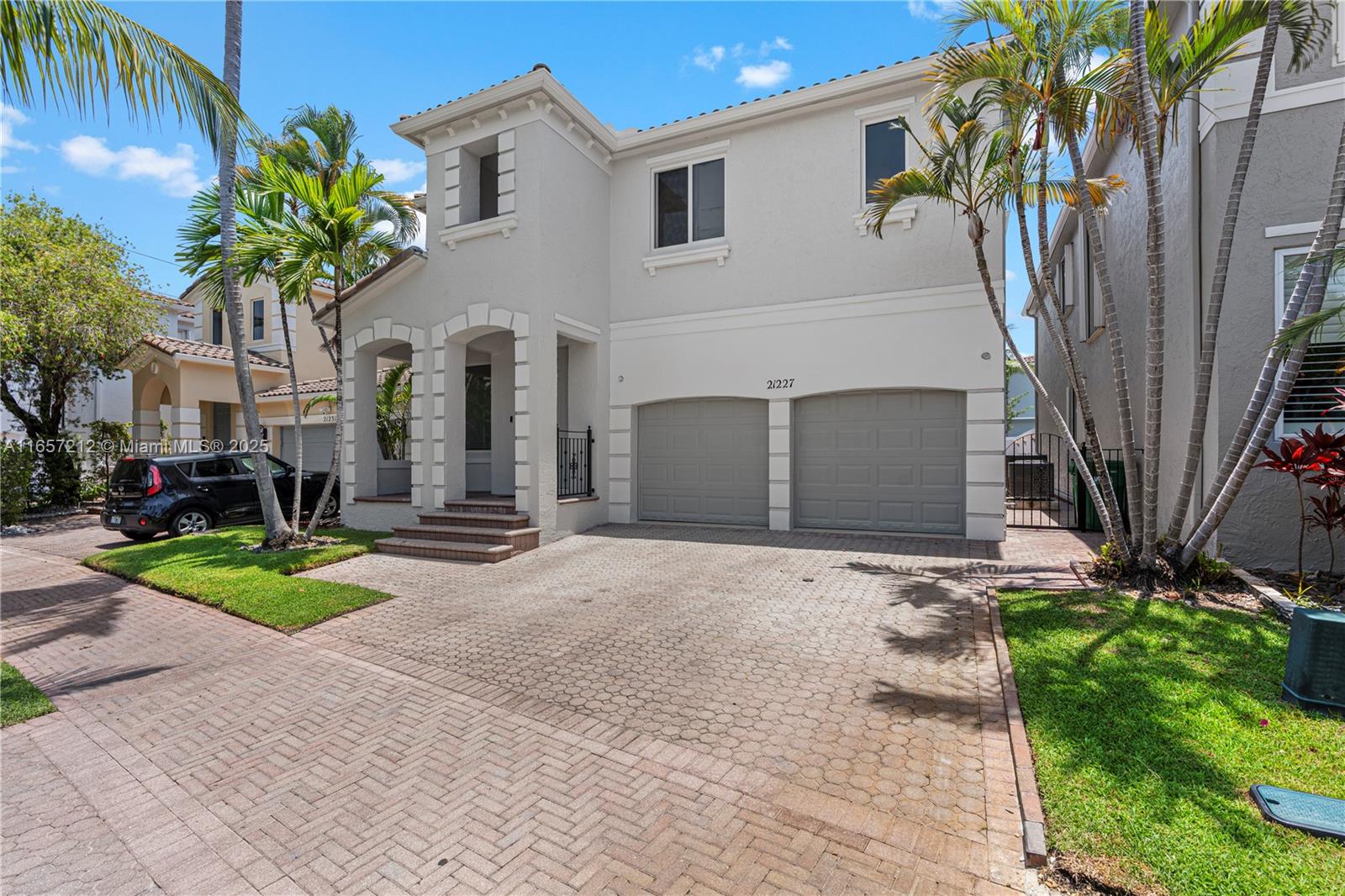 AVENTURA LAKES FULLY UPGRADED HOME. This exquisite 4-bedroom, 3.5-bathroom residence has been fully renovated with top-of-the-line finishes, offering an unparalleled level of luxury. The home features elegant built-ins and Italian porcelain flooring. The newly redesigned kitchen and bathrooms, as well as the upgraded flooring, reflect the highest standards of modern living. The expansive master bedroom includes his and hers closets, the oversized patio with turf provides an ideal space for entertaining. The property also includes a 2-car garage and additional parking for two additional cars. Residents enjoy access to one of the few gated communities with premium amenities, including a state-of-the-art gym, two pools, a jacuzzi, party room, toddler playroom, and more.