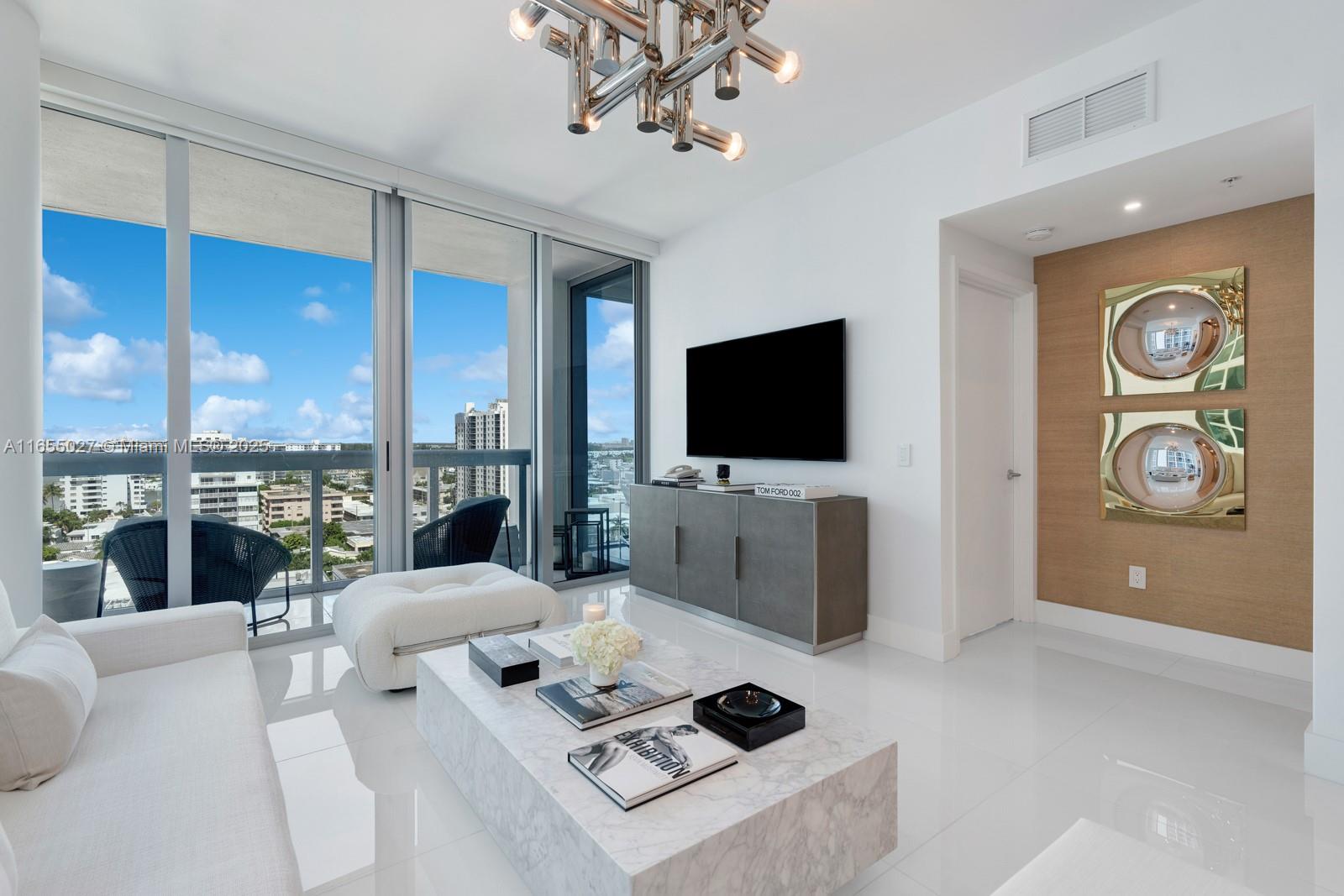 Discover luxury and wellness in this stunning turnkey oceanfront 1BD/1BA at the Carillon Miami Beach. Located in the most desirable North Tower, this sophisticated s/w corner 820 sqft unit delivers expansive natural light, floor-to-ceiling windows, w/gorgeous flooring throughout. Upscale details by exclusive designer featuring curated custom-made furniture pieces. Serene living room flows to a balcony overlooking the bay and Miami sunset skyline views. Enjoy a spacious spa-inspired bath w/Calacatta marble vanity, custom closets, designer lighting. Carillon's amenities include 70,000 sqft integrated spa and wellness space, 750 ft of beachfront with beach service, state-of-the-art gym with hundreds of classes, 4 pools, and Michelin-starred dining. 5-star amenities The best of Miami Beach