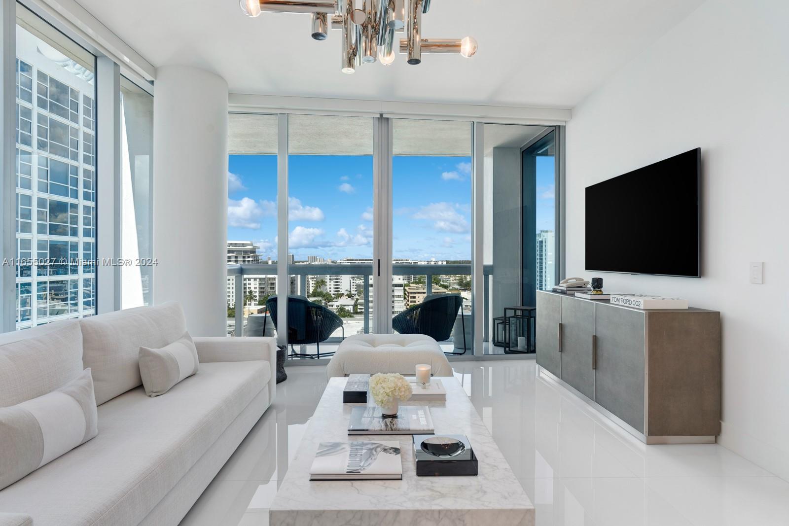 Discover luxury and wellness in this stunning turnkey oceanfront 1BD/1BA at the Carillon Miami Beach. Located in the most desirable North Tower, this sophisticated s/w corner 820 sqft unit delivers expansive natural light, floor-to-ceiling windows, w/gorgeous flooring throughout. Upscale details by exclusive designer featuring curated custom-made furniture pieces. Serene living room flows to a balcony overlooking the bay and Miami sunset skyline views. Enjoy a spacious spa-inspired bath w/Calacatta marble vanity, custom closets, designer lighting. Carillon's amenities include 70,000 sqft integrated spa and wellness space, 750 ft of beachfront with beach service, state-of-the-art gym with hundreds of classes, 4 pools, and Michelin-starred dining. 5-star amenities The best of Miami Beach