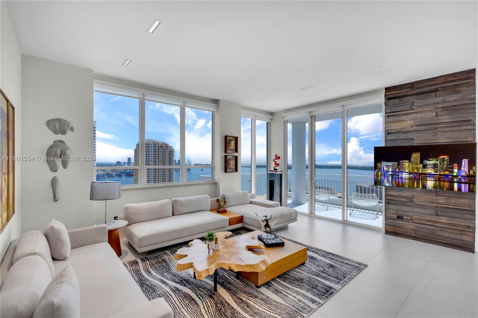 Dream Penthouse has two preferred parking spaces at the lobby level and storage under A/C—a luxurious corner unit on the exclusive Brickell Key island. Spacious two-bedroom, two-and-a-half bathrooms featuring a split plan offer privacy for both bedrooms and ten-foot ceilings. It is completely renovated with high-end finishes all around. Large corner balcony with panoramic views of the bay, intracostal, river, and city skyline. Italian kitchen cabinetry, frameless doors, and tile floors. The master bedroom features a walk-in closet—premium furniture and art for sale (optional).