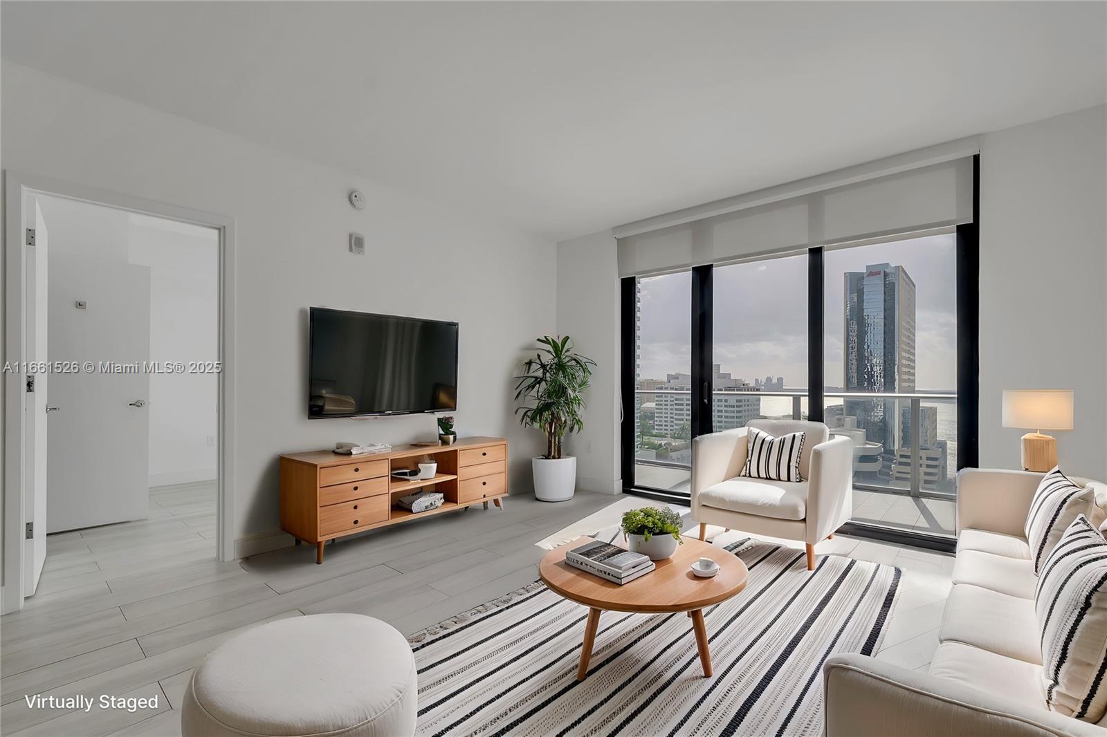 AVAILABLE FOR 6+ MONTHS. Enjoy the comfort of living in this spacious 2 BR + 3 BA that features an in-unit private elevator, 9-ft high ceilings, & floor-to-ceiling windows. 2 showers + 1 bathtub. In-unit W/D. Enjoy the skyline & partial bay views from the two in-unit balconies. 1010 BRICKELL is among the most amenitized buildings in Miami: rooftop pool & lounge, indoor poor, outdoor track, fitness center, indoor basketball/racquetball courts, kids playroom, game room, virtual golf, BBQ area, & spa. Located in the heart of Brickell - walking distance to the Metromover (public transportation), restaurant & shops, Brickell City Centre, & Mary Brickell Village. Short drive to Miami Beach, Key Biscayne, Coconut Grove, Downtown Miami, Wynwood/Midtown, & Design District.