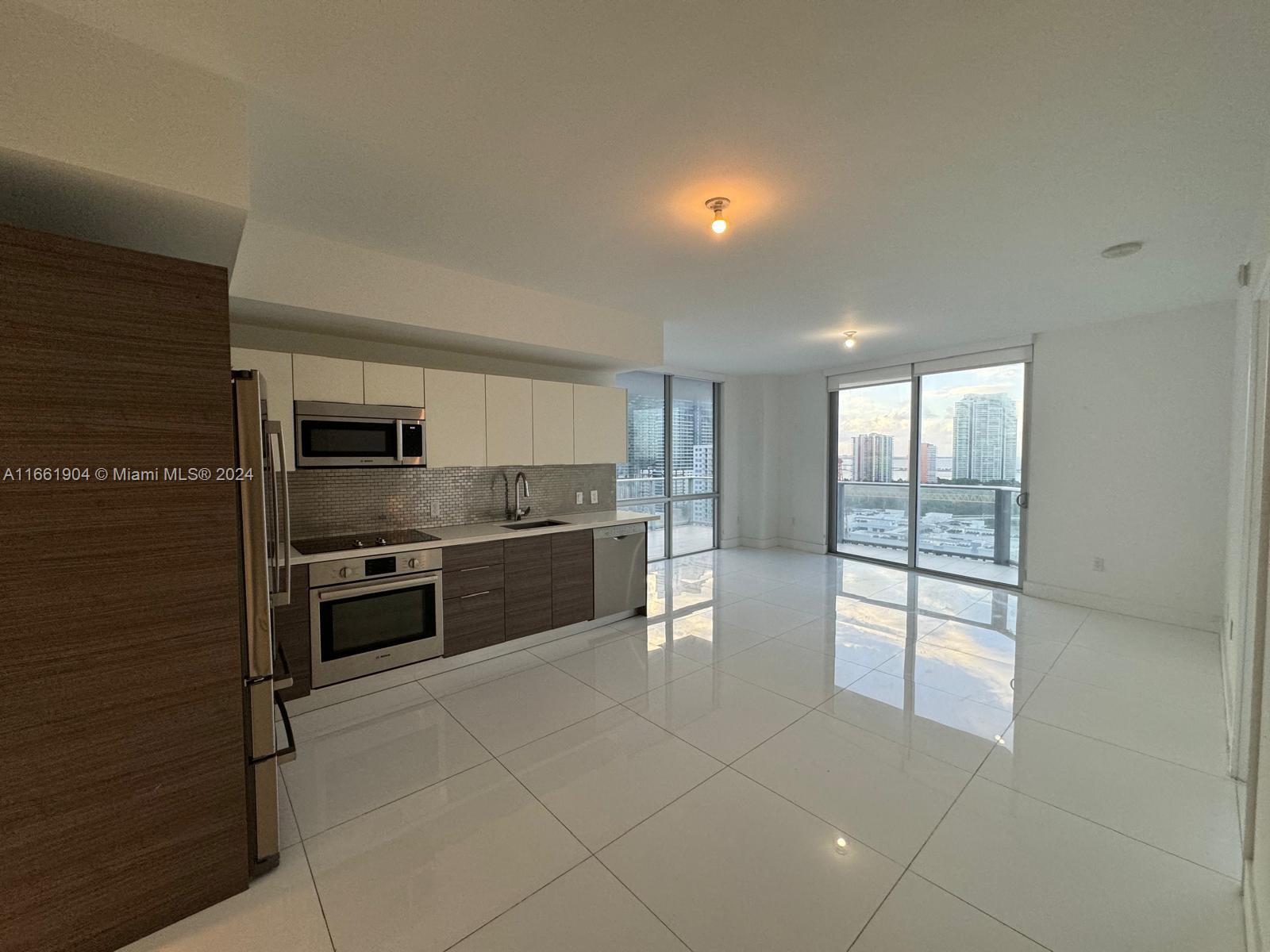 VERY NICE UNIT IN BRICKELL'S AREA WITH INTERIORS INSPIRED BY WORLD RENOWNED DESIGNER ADRIANA HOYOS! EXCELLENT PRICED 3 BEDROOMS + DEN/2.5 BATH UNIT. HIGH CEILINGS, OPEN LAYOUT, ITALIAN DESIGNED BATHROOMS AND EXPANSIVE TERRACE MAKE THIS THE PLACE TO LIVE! BLDG FEATURES GREAT EQUIPPED GYM, ROOFTOP POOL, BAR, JACUZZI AND KIDS ROOM. UNIT HAS 2 ASSIGNED PARKING SPACES # 13 & 14 AND 1 STORAGE BIN. LOCATED IN THE HEART OF BRICKELL, NEXT TO SHOPS, RESTAURANTS, BUSINESSES, AND EASY ACCESS TO MAJOR HIGHWAYS.