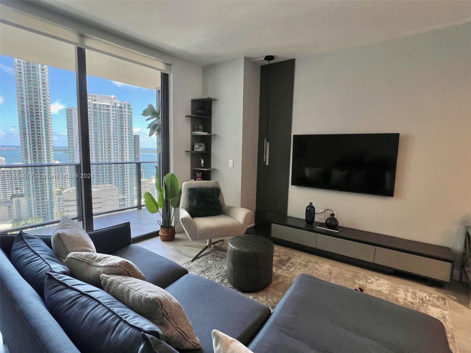 Experience luxury living at Brickell Heights in this immaculate, fully furnished 1 bedroom+den with 2 full bathrooms and sweeping water and city views. The unit is very tastefully furnished with high-end upgrades done by owner. Designed with high-end finishes, including European-style cabinetry, premium appliances, custom walk-in closet, in-unit washer and dryer, and a spacious balcony. Perfectly situated in the vibrant Brickell area, within walking distance of top restaurants, bars, Brickell City Centre, and fitness studios. Amenities include a rooftop pool with panoramic views, fitness center, jacuzzi, sauna, steam room, kids playroom, 3 club rooms, and Equinox gym in the building. Perfect for sophisticated urban living! 1 valet parking included, internet and cable. AVAILABLE 01/15/2025