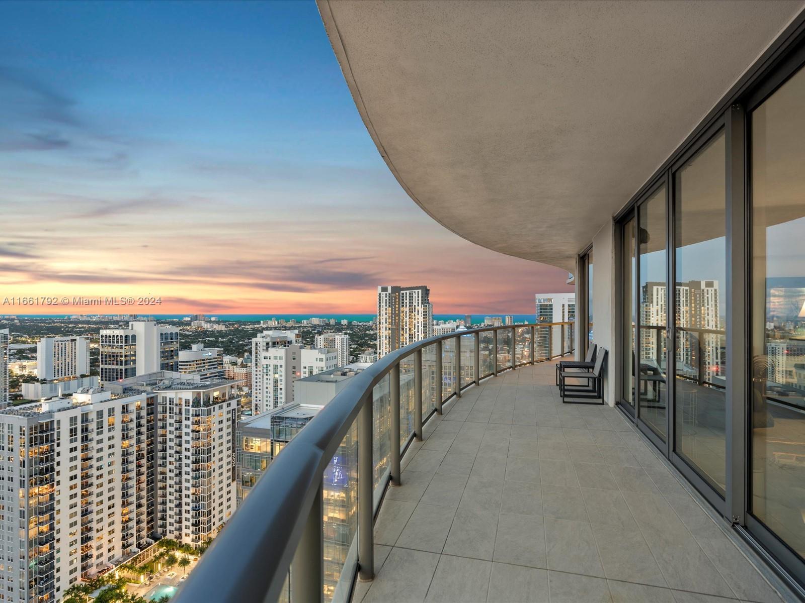 Situated high on the 40th floor, this opulent residence at 100 Las Olas offers breathtaking, unobstructed skyline views through expansive floor-to-ceiling windows. One of only six exclusive estate plans, this 4-bedroom, 4.5-bath home boasts a private elevator entrance and access-controlled entry for ultimate privacy. Inside, discover sophisticated touches like premium flooring, sleek European kitchen cabinetry, quartz countertops, and high-end fixtures throughout. The open layout includes a formal dining room, family room, and theatre room, all seamlessly extending to private terraces with glass railings for panoramic vistas—ideal for hosting unforgettable evenings against the backdrop of the city’s vibrant sunsets. Inquire today to make this villa in the sky yours!