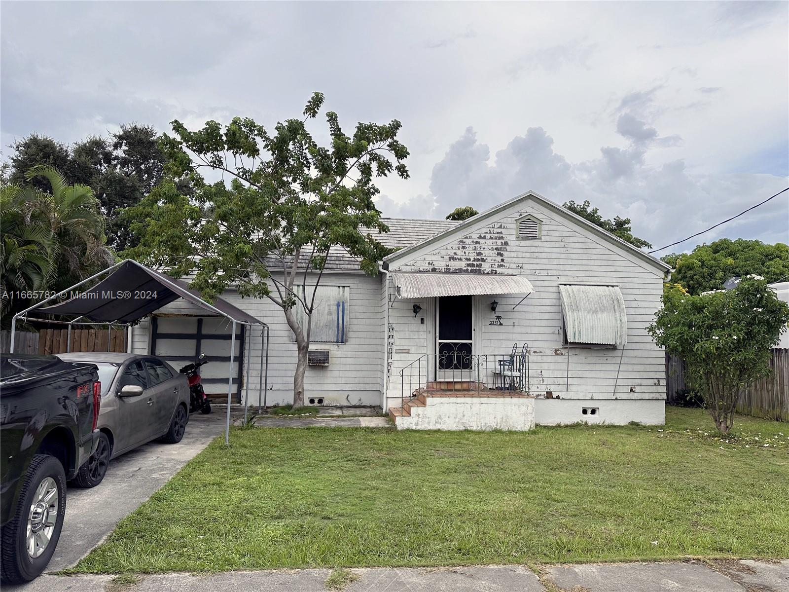 Welcome to this charming 2-bed, 1-bath Miami gem located at 2737 NW 4th St! Priced at $525,000, this 1939 classic offers 1,046 sq ft of living space and sits on a spacious 7,540 sq ft lot in the desirable Grosse Pointe Highlands. Enjoy beautiful wood floors, a versatile layout with a den, family room, and Florida room, plus plenty of storage with built-ins and closet cabinetry. The fully fenced yard features fruit trees and an open porch, perfect for outdoor relaxation. With easy access to top-rated schools, shopping, and Miami's vibrant culture, this home offers both comfort and convenience. Move-in ready or lease out – this property is a fantastic investment opportunity. Don’t miss out on this Miami classic!