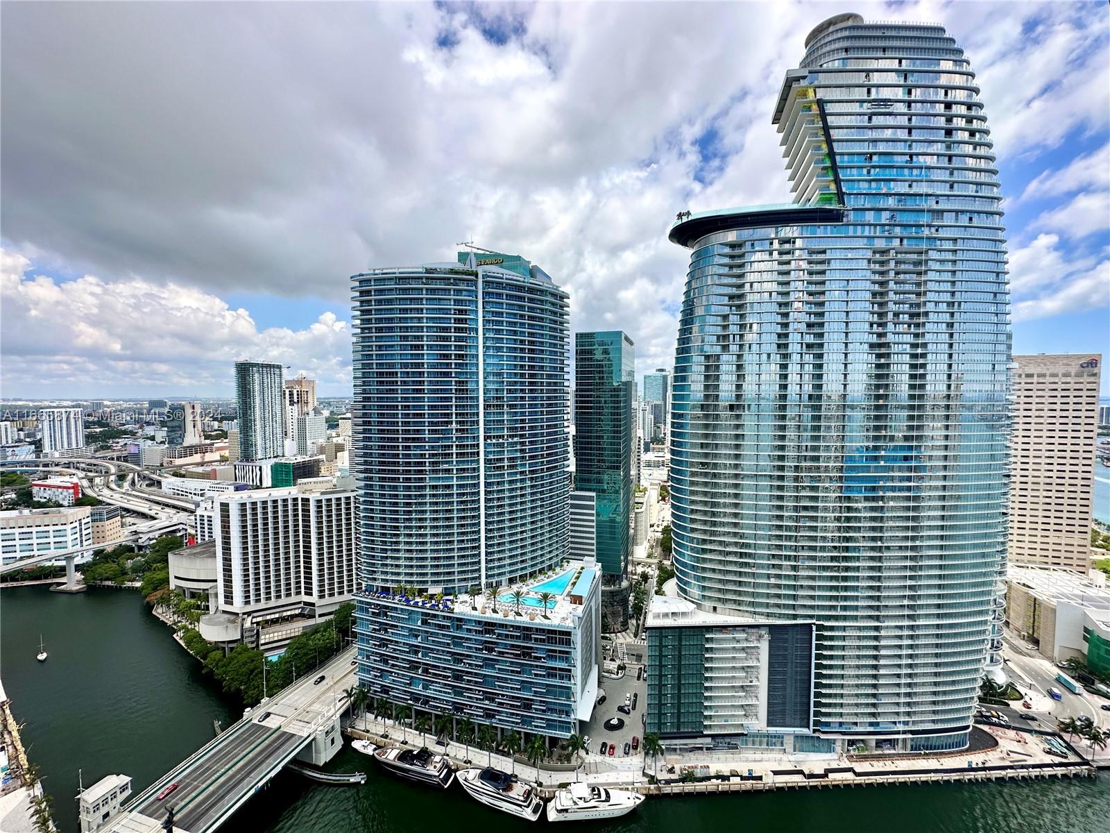 This impeccable unit on the 40th floor offers breathtaking views of the Miami River and the city skyline. Located in the heart of Brickell, just steps from Brickell City Centre, it boasts floor-to-ceiling windows and an expansive layout with 940 interior square feet and 142 exterior square feet, as per the developer’s floor plan. The luxurious ICON Brickell complex features top-rated on-site dining, a renowned pool deck with an Olympic-sized pool, the Icon Café by the pool, and an extraordinary two-story spa and fitness center. The unit also includes one assigned parking space, offering the ultimate Miami lifestyle experience.