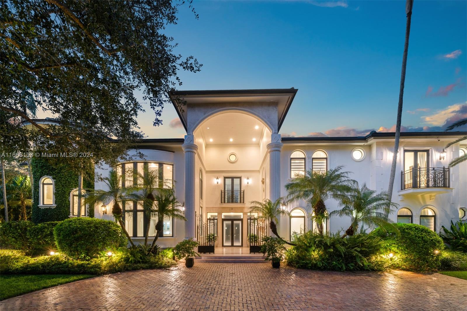 This grand gated Spanish estate in N Pinecrest is set on an expansive 38,332 SF corner lot. With 6,262 SF of luxurious living space, the residence features 6 bed rms & 8 bath rms. The grand entrance opens to expansive living areas with soaring double-height ceilings & impact-resistant windows & doors. The home includes a temperature-controlled wine cellar, a bar, & a gourmet kitchen with a cooking island, gas range, & custom-built pantry. Marble floors, intricate moldings, & elegant textures add to the refined atmosphere. The tranquil backyard offers balconies overlooking a private garden, a covered patio, & a sparkling pool with a Jacuzzi. Additional fts. include custom built-in closets, 3-car garage, a new roof, brand-new full house generator, & exterior lighting.