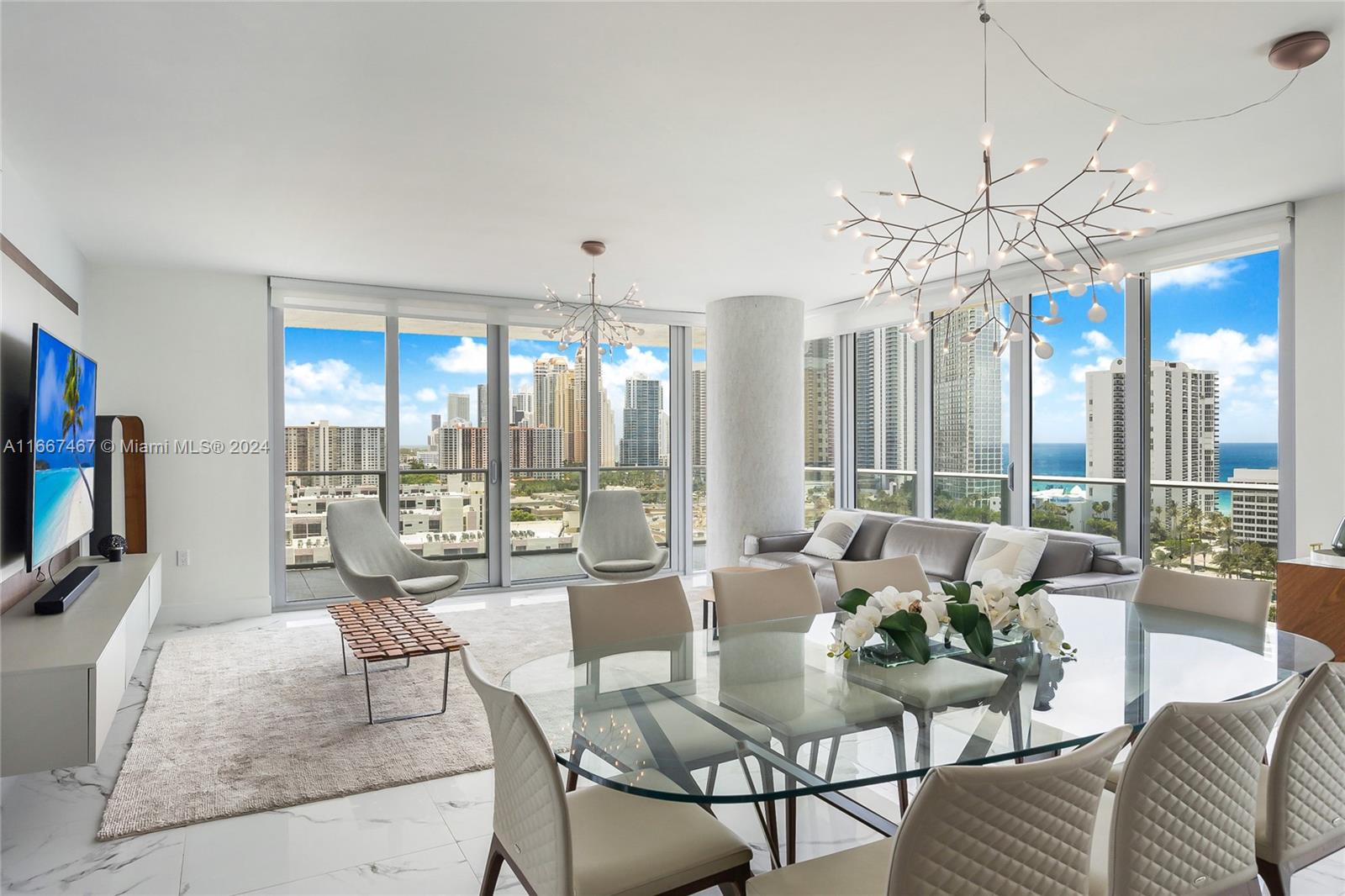 Available for the seasonal or annual rent staring Oct 15th, 2024 for min 4 months. Located in beautiful Sunny Isles Beach, this turnkey furnished corner unit is within walking distance to the beach, restaurants, and bars. The expansive 1,892 sq. ft. home features 10ft ceilings, floor-to-ceiling impact glass windows and doors, and a wrap-around terrace with stunning panoramic views. It offers high-end European appliances, window treatments, and light fixtures throughout. The primary suite includes a walk-in closet and a luxurious bath. Amenities: beach service, 4 pools, jacuzzi, gym, spa, kids club, theater, games room, bistro, party room, and guest suite.  No pets as per association for tenants, service and emotional support pets are ok. Vacant and easy to show