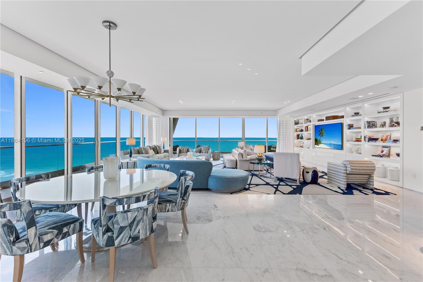 LUXURIOUSLY APPOINTED NAUTICAL CHIC IN THIS HUGE FLOW-THRU CORNER RESIDENCE BY BRAZILIAN DESIGNER SIG BERGAMIN AT THE ACCLAIMED FENDI CHATEAU IN SURFSIDE! Curated Elegant Living Area Lounge all in a Coastal Color Palette Overlooking the Ocean. Massive Floorplan w/ Teak Yacht Flooring & Italian Calacatta Stone. 4 Beds + 6.5 Baths in 6,726 SF Interiors + 1,885 SF Terrace. Fendi Designer Eat-In Kitchen w/Gaggenau Appliances & Wine Fridge. Formal Dining Area & Family Room Overlooking Miami’s Downtown Skyline. Deep Terrace features Summer Kitchen. Massive Primary Bedroom w/Breathtaking Ocean Views. 2 Primary Bathrooms Wrapped in Italian Marble & Spacious Walk-In Closet. Game + Theatre Room. 10 FT Ceilings, Frameless Lualdi Doors, Linear Diffusers & Laundry w/ Storage & Staff Quarters.