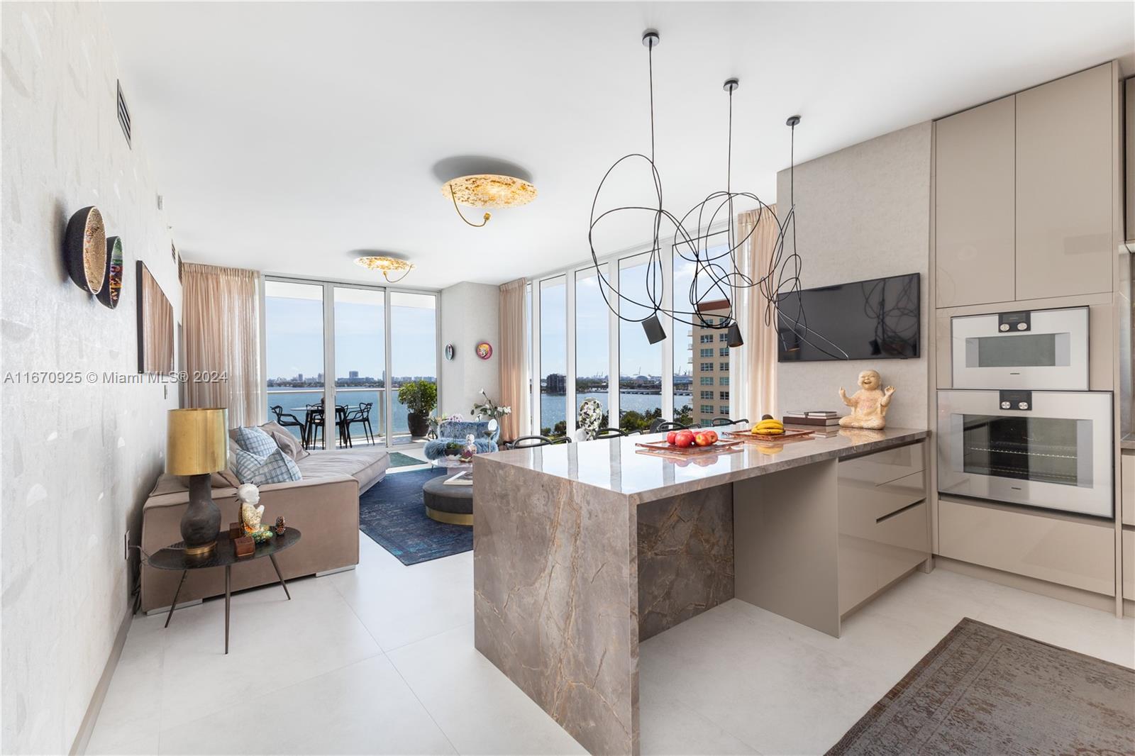 Experience ultra-luxury in this fully gut-renovated 3-bedroom condo at the iconic Paramount Bay Residences in Edgewater. With 1,679 sq ft of designer interiors & sweeping Biscayne Bay views, this residence offers modern elegance with custom cabinetry, Gaggenau appliances, and a stunning quartz waterfall island in the open-concept kitchen. The primary suite boasts a spa-like bath with a rainfall shower. Enjoy resort-style amenities, including sunrise & sunset pools, a state-of-the-art gym, and 24/7 concierge service. Known for exceptional management, Paramount Bay also offers some of the best valet services in the city. Live steps away from Miami’s finest cultural landmarks & enjoy the ultimate in sophisticated living.