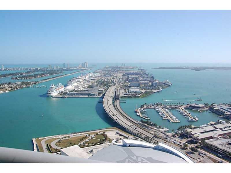 Marinablue.  Amazing views from this 1bed/1.5 bath with hardwood floors, motorized blinds, stainless steel appliances and granite countertops.  Building offers 24 hour security, two heated pools, fitness center, hot tub, beach volleyball and business center.  Minutes to SoBe, Brickell, Design District, Wynwood and all major highways.