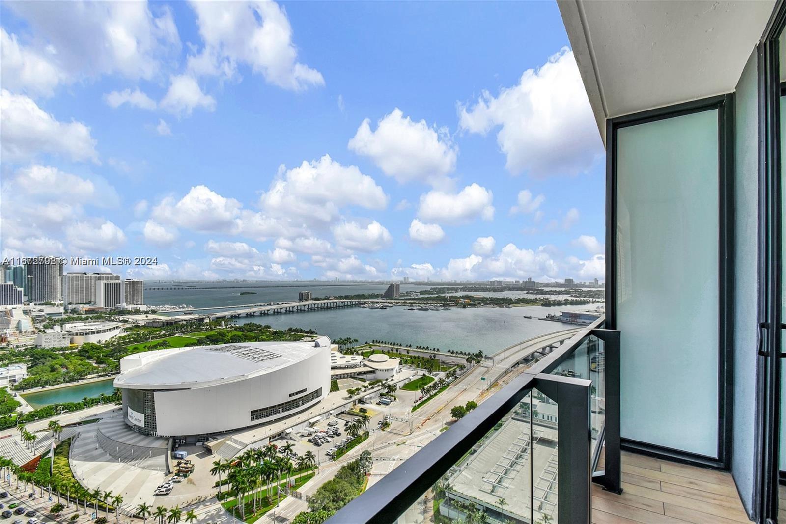 3 years of HOA FREE and $7500 chase grant eligible! Own a part of Miami World center with one of the few buildings downtown that allows daily short term  or long term rentals! This turn-key gem, has direct water views and comes furnished. Enjoy luxurious features like 9+ floor-to-ceiling windows, porcelain wood-grain tile flooring, and quartz countertops. The kitchen boasts  Italkraft cabinets, with fully built-out cabinets. This fully furnished residence features a private balcony overlooking Biscayne Bay, modern bathrooms with frameless glass showers, benefit from an in-unit washer/dryer, large walk-in closets, a smart thermostat & keyless entry. Exclusive amenities include a 132-foot resort-style pool, lounge with LED wall, a sky lounge, and gym