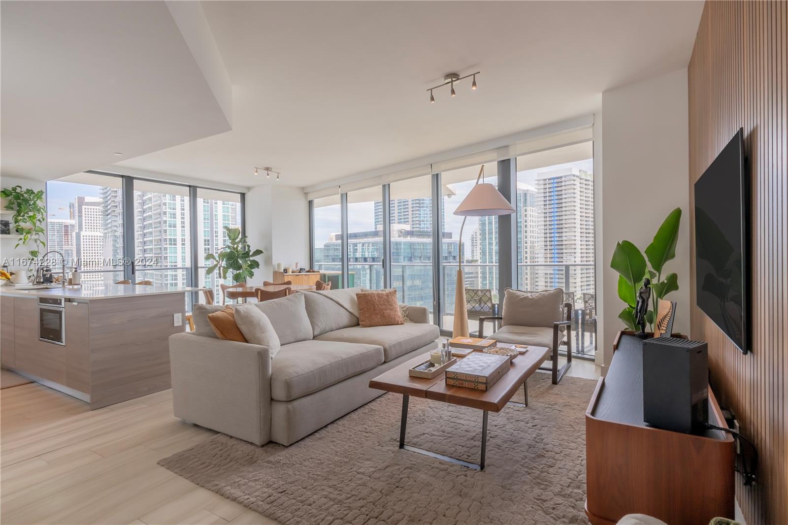 Luxurious living meets exceptional value in this stunning corner unit featuring panoramic bay and city views along with an expansive wraparound balcony. This residence includes a spacious den and can be sold fully furnished and decorated for a seamless move-in experience. Located in the heart of Brickell, you’re just steps away from shops, dining, groceries, and office buildings, with quick access to Brickell’s 'backdoor' exit to avoid traffic by car. Priced under $850 per sf, this unit offers an incredible deal compared to new developments on the same street selling for around $2,000 per sf. Enjoy all this in a beautifully appointed building among the newest in Brickell, with premium finishes and world-class amenities, including a lap pool, state-of-the-art gym, and concierge services.