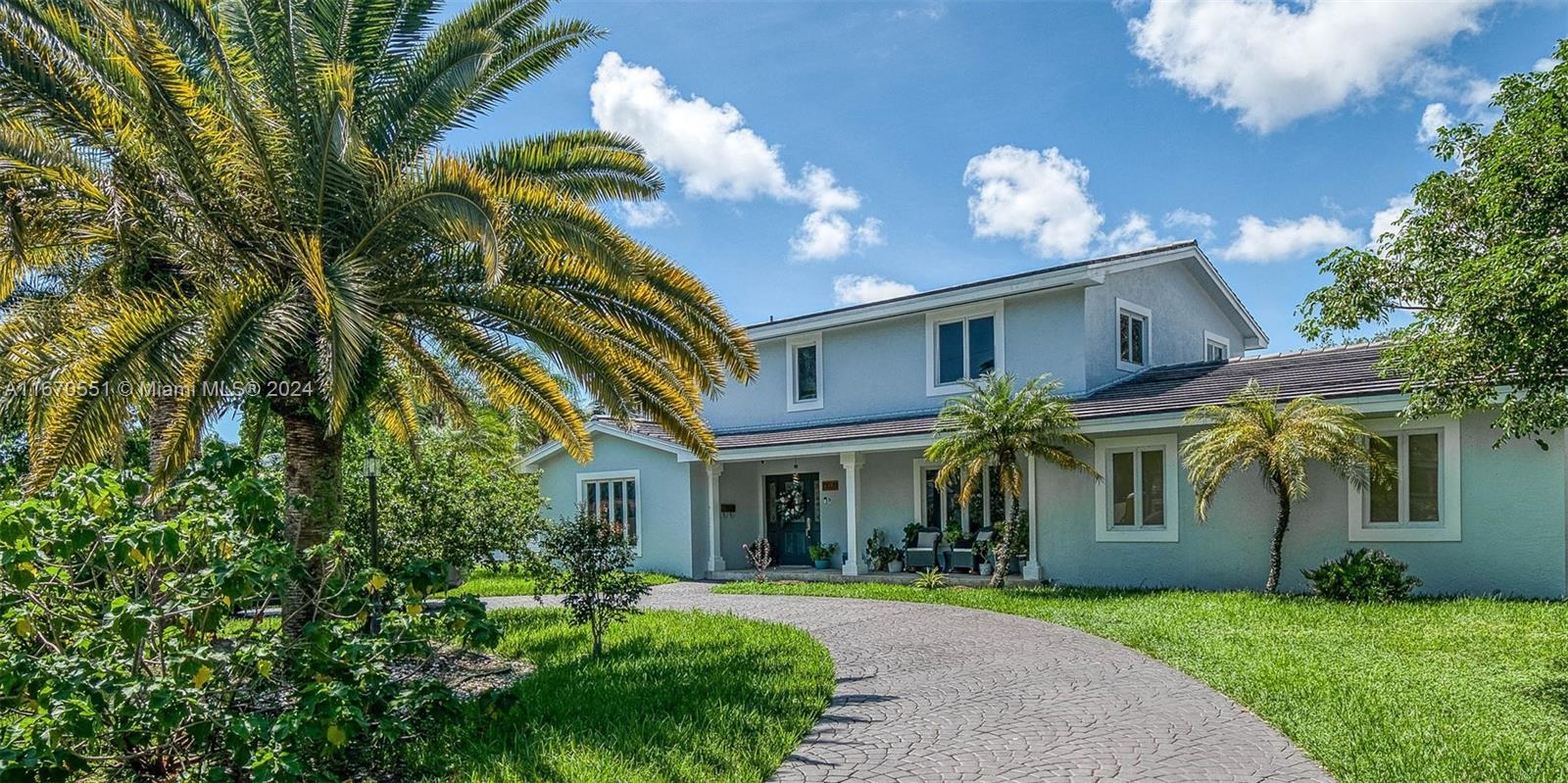 Unique opportunity to own this single family - canal home - on Palmetto Island!! This 5bd/4bth residence offers spacious living with a formal living and dining area, plus cozy family room. The ground floor main bedroom, which leads out to the pool area, features an adjacent bonus room—perfect for a home office, gym, or in-law suite. The upstairs four bedrooms and two full baths are conveniently located upstairs and feature wood flooring throughout.  The modern kitchen features stainless steel appliances and granite countertops. Exit from the pool area into your own private garden/doggy run with canal access and serene water views. With a circular driveway providing ample parking, this home combines comfort and elegance in a desirable "island" location. Will not last!!