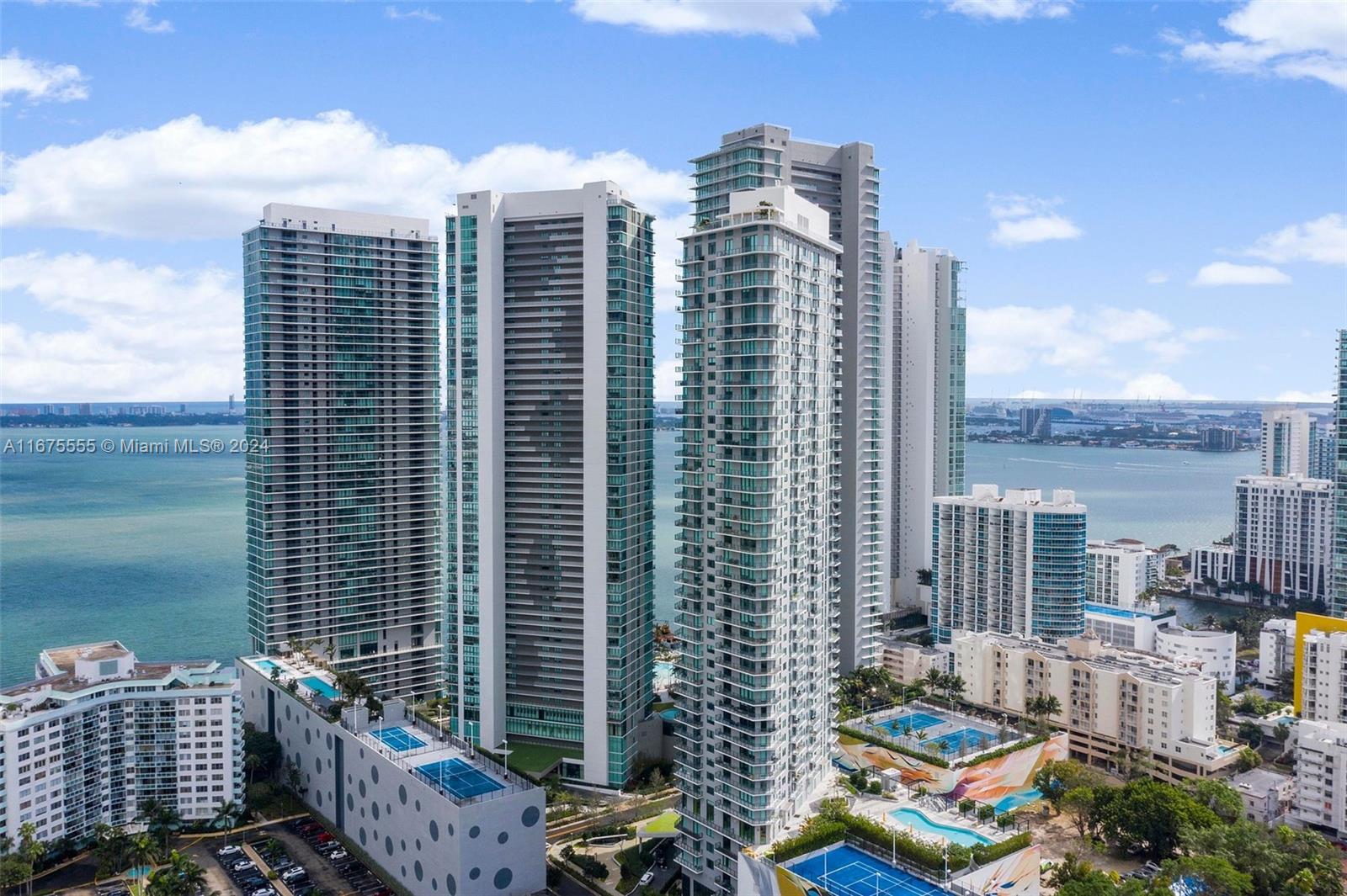 Gorgeous 1 bedroom + enclosed Den/1.5 bathrooms at spectacular Paraiso Bayviews. Just 5 minutes away from Midtown and Design District shops and restaurants, 10 minutes from the beach and 15 minutes from the airport. The apartment has floor-to-ceiling glass windows with spectacular view of the city and the bay. Enjoy the amenities at Paraiso Bayviews including a rooftop pool, sunset pool, lighted tennis court, paddle court, BBQ areas, children’s’ playroom, billiard’s room, state-of-the-art fitness center, theater, spa, valet parking, and concierge. Residents of Paraiso Bayviews also have access to the BoardWalk and Paraiso Beach Club with Amara restaurant from acclaimed chef Michael Schwartz. You can rent it minimum 30 days 12 times a year.