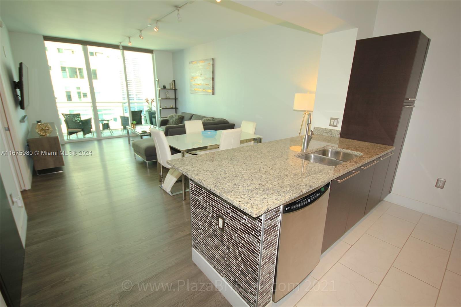 VERY REFINED 1 BEDROOM FOR EXECUTIVE RENTAL. NO DETAILS HAVE BEEN SPARED IN THE DESIGN OF THIS SPACIOUS FURNISHED 1 BEDROOM. ENTIRELY EQUIPPED KITCHEN WITH ITALIAN CABINETS. HIGH STOOLS. DINING TABLE. NICE VIEWS FROM THE BALCONY TO BRICKELL KEY AND MIAMI NIGHT LIGHTS. UPSCALE CLOSET VERY WELL ORGANIZED. ELECTRIC BLINDS IN LIVING-ROOM. ONE ASSIGNED PARKING SPACE. IDEALLY LOCATED IN THE CENTER OF BRICKELL. LUXURY BUILDING WITH ALL AMENITIES. HEATED INFINITY SWIMMING POOL. JACCUZI. 24/7 PROFESSIONAL GYM. BUSINESS CENTER. CHILDREN PLAYROOM. FRONTDESK. VALET PARKING. 1.5 BLOCK TO BRICKELL CITY CENTER & MARY BRICKELL VILLAGE. ULTRA-FAST APPROVAL.