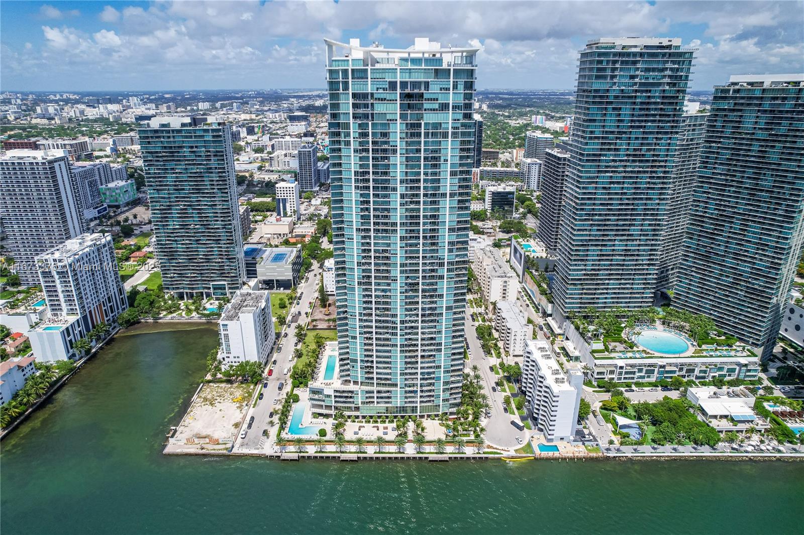 Experience unparalleled luxury living at Biscayne Beach in this 52nd-floor gem, offering breathtaking panoramic views of the Bay. This expansive 3-bedroom, 4-bathroom unit with a den is designed for those who appreciate the finest details, featuring top-of-the-line Miele appliances and sophisticated finishes throughout. Wake up to stunning sunrises from your private oasis. Two parking spots and a storage unit are included for your convenience. Indulge in the world-class amenities, including a private beach club with pools, tennis courts, a spa, gym, restaurants, and more. This is Edgewater living at its absolute finest!