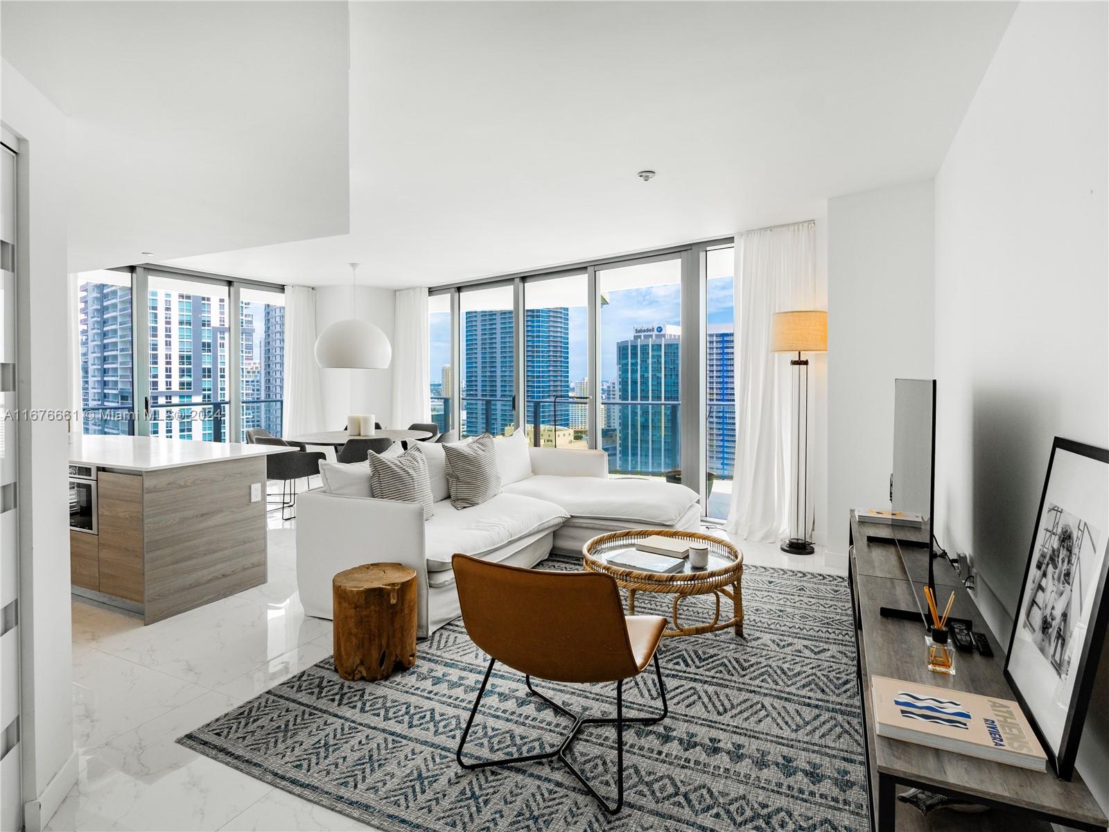 Welcome to an exquisite urban sky residence in the heart of Brickell. This stunning corner unit boasts 1,279 square feet of modern elegance and offers breathtaking skyline and ocean views from every room. The unique layout features 2 spacious bedrooms plus a versatile den, perfect for an office or creative space. Step into a world of luxury with state-of-the-art amenities that include a refreshing pool and sky roof pool area for ultimate relaxation. Enjoy the convenience of a doorman, concierge service, and valet parking and a state of the art GYM and entertainment room.  Entertain guests in the BBQ area or take advantage of the business center for professional needs. Experience the epitome of five-star living in a premier building, where every detail is designed to elevate your lifestyle.