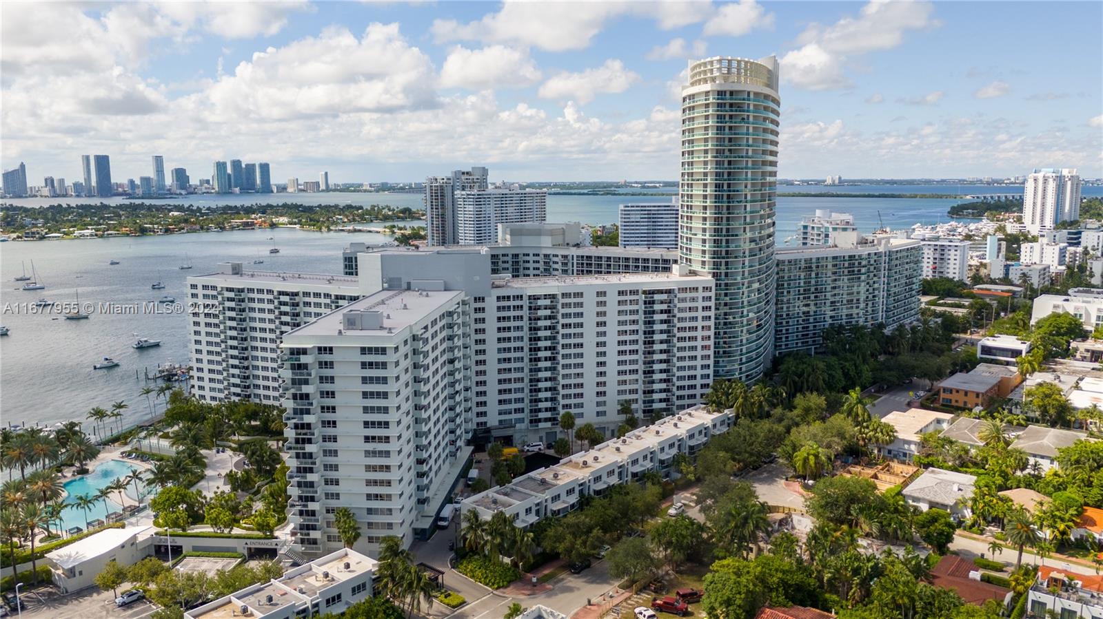 Stunning corner penthouse offers 2,029 square feet of elegantly designed space with panoramic bay, ocean and SoBe views (West, East + South). Welcome every sunrise and sunset from the two private balconies.  Live in the center AND top of South Beach on 16.5 waterfront acres in the heart of the city.  The star of the condo is the 40 ft long Great Room with floor to ceiling hurricane-impact windows.  Outdoor enthusiasts will appreciate the bay-front pools, barbecue area, common garden, and patio spaces, perfect for entertaining or unwinding. Big indoor playroom adds to the family appeal. Pet spa on-site also offers convenient doggie care and dog-sitting. 2 garage spaces , health club, no assessments and secure finances .  Price is firm and seeking strong offers at list price!