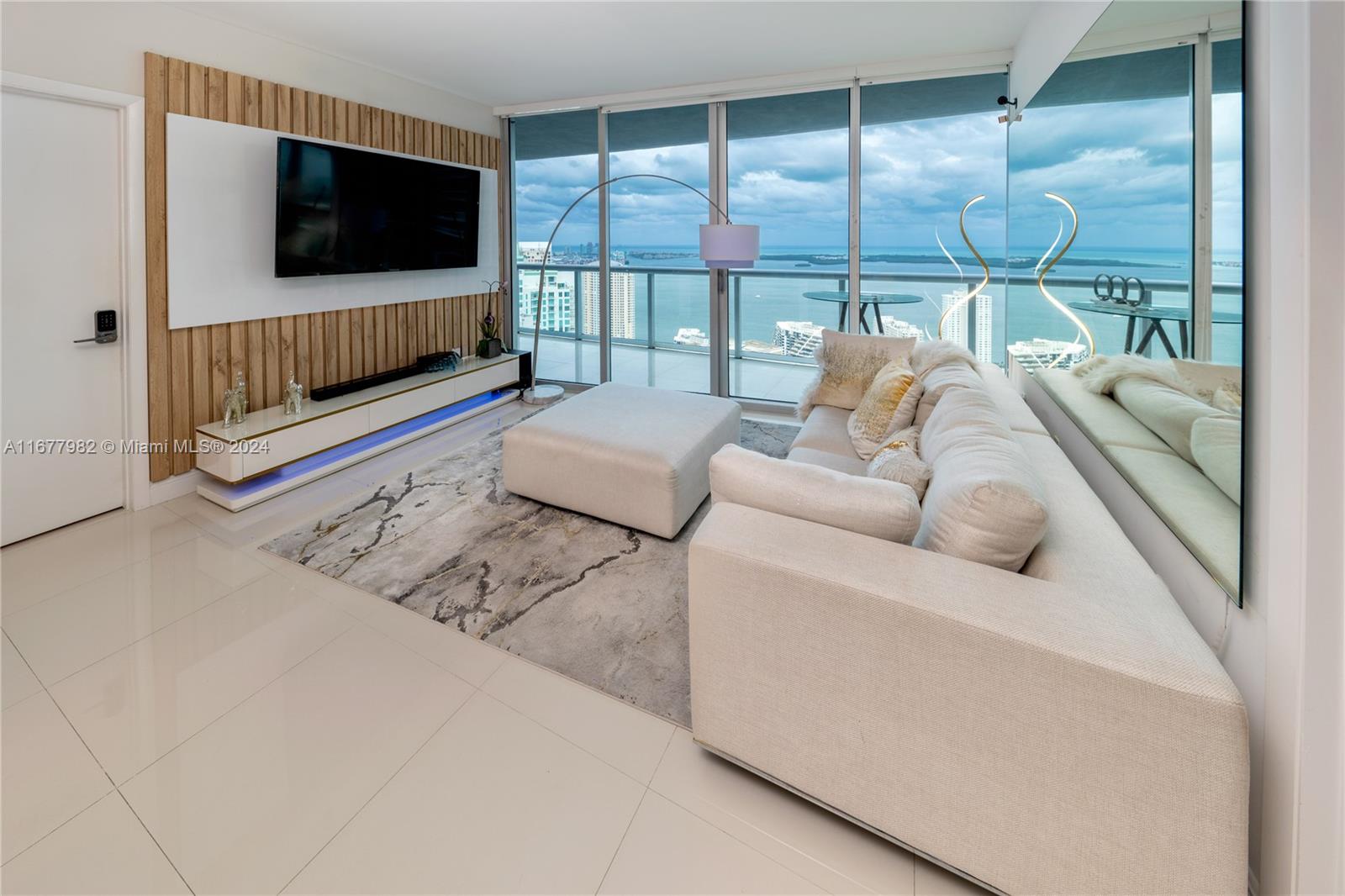 Breathtaking view of Ocean Biscayne Bay. 2 bedroom 2 bathroom & den (with the possibility to make a 3rd bedroom). Kitchen with Calacatta Stone, bathrooms, and closets completely remodeled. Smart "mood" lighting throughout the apartment. 24/7 concierge, valet parking services, fitness center, luxury spa, olympic pool, pilates, spinning room, movie theater, one assigned parking space. Steps away from pedestrian-friendly cafes, restaurants, night time establishments, boutiques, and parks.