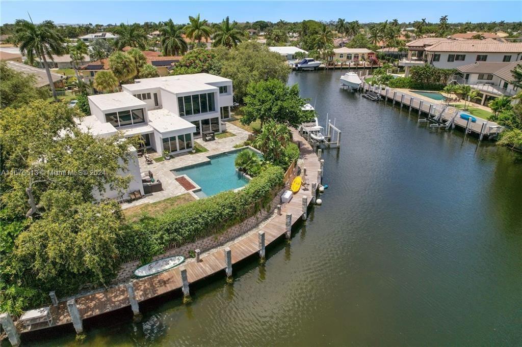 GORGEOUS POINT LOT WATERFRONT BOATERS DREAM HOME! PLENTY OF DOCK SHORE POWER & WHIP. DEEP WATER 197 FT DOCKAGE. AN AMAZING WALKWAY DOWN TO THE DOCK, NO FIXED BRIDGES DIRECT OCEAN ACCESS BIG TURNING BASIN, 16,000 LB LIFT, POWER & BUILT-IN FENDERS. ALLOWS FOR MULTIPLE BOATS. PANORAMIC POOL WATER VIEW. NEW ROOF, AC & CEILING. LUSH B/YARD GARDEN VIEW. BUILT-IN BBQ GRILL WITH FRIDGE. NEWER OPEN GOURMET KITCHEN, TOP OF THE LINE APPL. SMARTHOME WIRED LUTRON, ALL LED LIGHTS. SPEAKERS & SOUND SYS THROUGHOUT HOME. HOME THEATER WIRED. LARGE DEN CAN CONVERT TO 4TH BDRM IF NEEDED. GORGEOUS & PRIVATE MASTER SUITE WITH SITTING AREA, WALK IN CLOSET OR JUST ENJOY THE WALLS OF GLASS OVERLOOKING THE POOL. ALL IMPACT WINDOWS & DOORS. MINUTES TO THE INTRA, HILLSBOROUGH INLET & LIGHTHOUSE POINT YACHT CLUB!