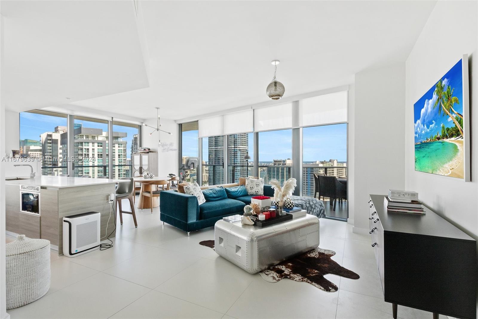 This bright and spacious 2/2 + Den corner unit boasts 1,279 square feet of elegantly designed living space, featuring a versatile den perfect for a home office or guest room. Enjoy panoramic skyline and ocean views from abundant windows which fill the space with natural light. The unit features high-end finishes, a contemporary kitchen with top-of-the line appliances and modern bathrooms. The spacious layout is perfect for entertaining, with a seamless flow between the living, dining, and kitchen areas. Situated in the vibrant Brickell neighborhood just steps away from world-class dining, shopping, and nightlife. Building amenities include: lap pool, rooftop pool, state-of-the-art gym, business center, clubroom & more. Unit comes with 1 assigned parking spot: #650; 2 pets allowed per unit