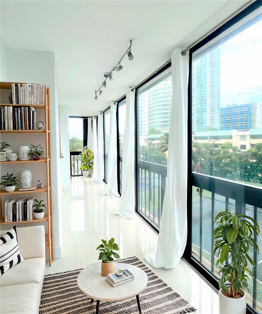 Spacious 1,760 sqft waterfront condo in Brickell. 2 beds, 2 baths, and a versatile den that can easily be converted into a third bedroom. This remodeled unit boasts porcelain tile flooring, an open kitchen with granite countertops, ample closet space, and a laundry room. Enjoy a wrap-around enclosed balcony with stunning views. The building offers resort-style amenities, including 24-hour gated security, concierge, valet, 5 tennis courts, 3 racquetball courts, a heated Olympic pool, BBQ area by the bay, fitness center, steam room, sauna, game room, convenience store, and more. Located in the Brickell area, this prime spot provides a peaceful retreat while still being near the vibrant city scene, close to I95, nice walking area,  perfect for those seeking a balance of calm and convenience.