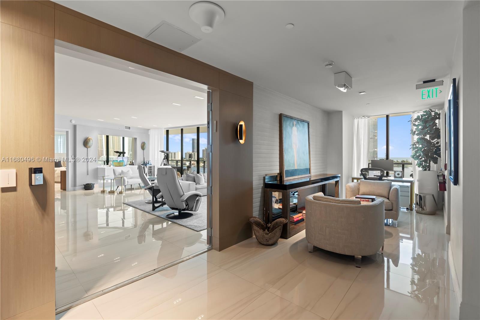 Experience Prive Island in Aventura. This stunning 4-bed, 5.5-bath residence offers breathtaking water views of Sunny Isles and the Intracoastal. Appointments include a terrace w/ outdoor kitchen, expansive living areas w/natural light, private foyer currently converted into a small office; gourmet kitchen, and spacious bedrooms with en-suite baths. Large pantry and extra fridge/freezer. The principal suite includes a spa-like bathroom and ample closet space. Smart Home. Dropped ceilings throughout for recessed led lighting.
Electric black out shades. Prive Island amenities include a gym, pools, stylish lounges, tennis court, a children's lounge, a scenic walking path, and a wine cellar. Prive Island, an enclave where you will experience the utmost privacy in sophisticated setting.