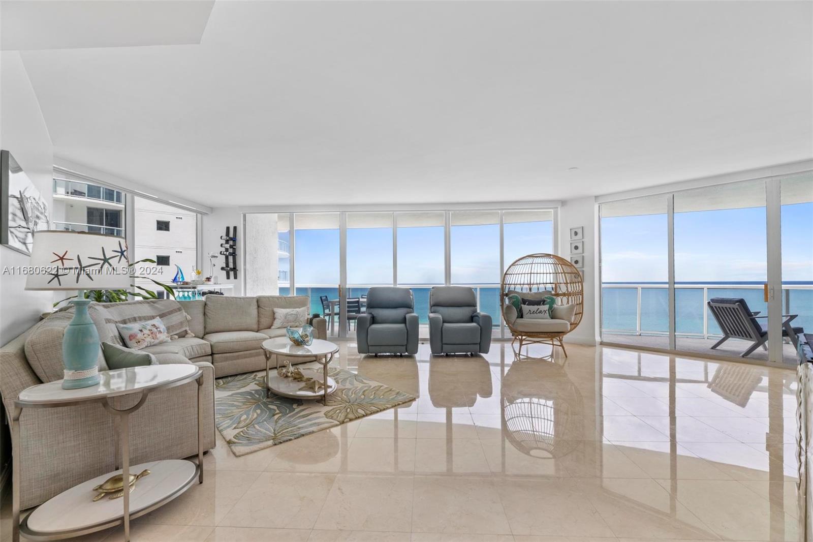 Breathtaking oceanfront views! Waterfront Fully Furnished Beach Condo in the exclusive Millennium Condo in Sunny Isles Beach: 3 beds, 3.5 baths, 2,210 sq. ft. with direct ocean views. Features marble floors, a large panoramic open balcony, and a private elevator directly into your unit. Includes 2 parking spaces. Washer/Dryer in unit. Amenities: heated pool with Jacuzzi, two-story gym, sauna, tennis court, party room, business room, and beach/valet services. Seasonal Rental. Ideal for those seeking a serene escape with all the conveniences of upscale living.