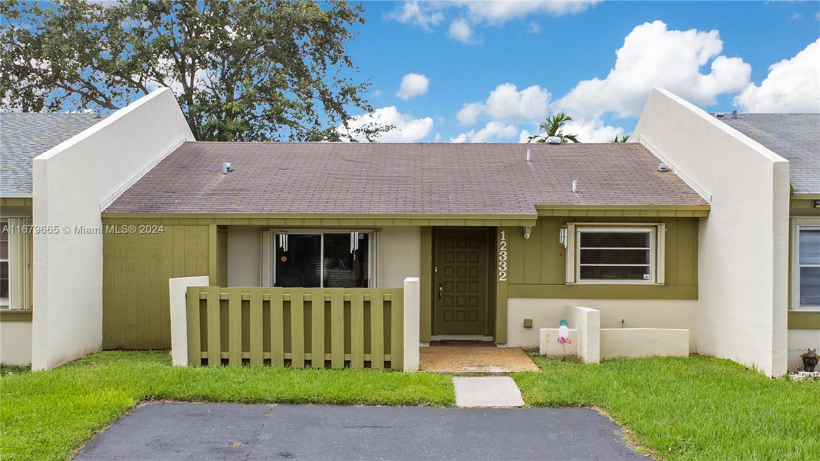 Charming 2-bedroom, 2-bath home in Kendall with 1,003 sq ft of living space. This property offers vintage appeal with modern updates, perfect for first-time buyers. High ceilings create an open atmosphere, connecting the living area to the kitchen for entertaining and daily use. Enjoy a private, fenced rear patio and a quaint front porch for relaxation. The roof is being replaced, ensuring readiness for future residents. With a low HOA, it offers streamlined living. Located near shopping, dining, parks, and attractions, with easy freeway access for travel throughout Miami. Invest in this blend of vintage charm and modern reliability. Schedule a showing today!