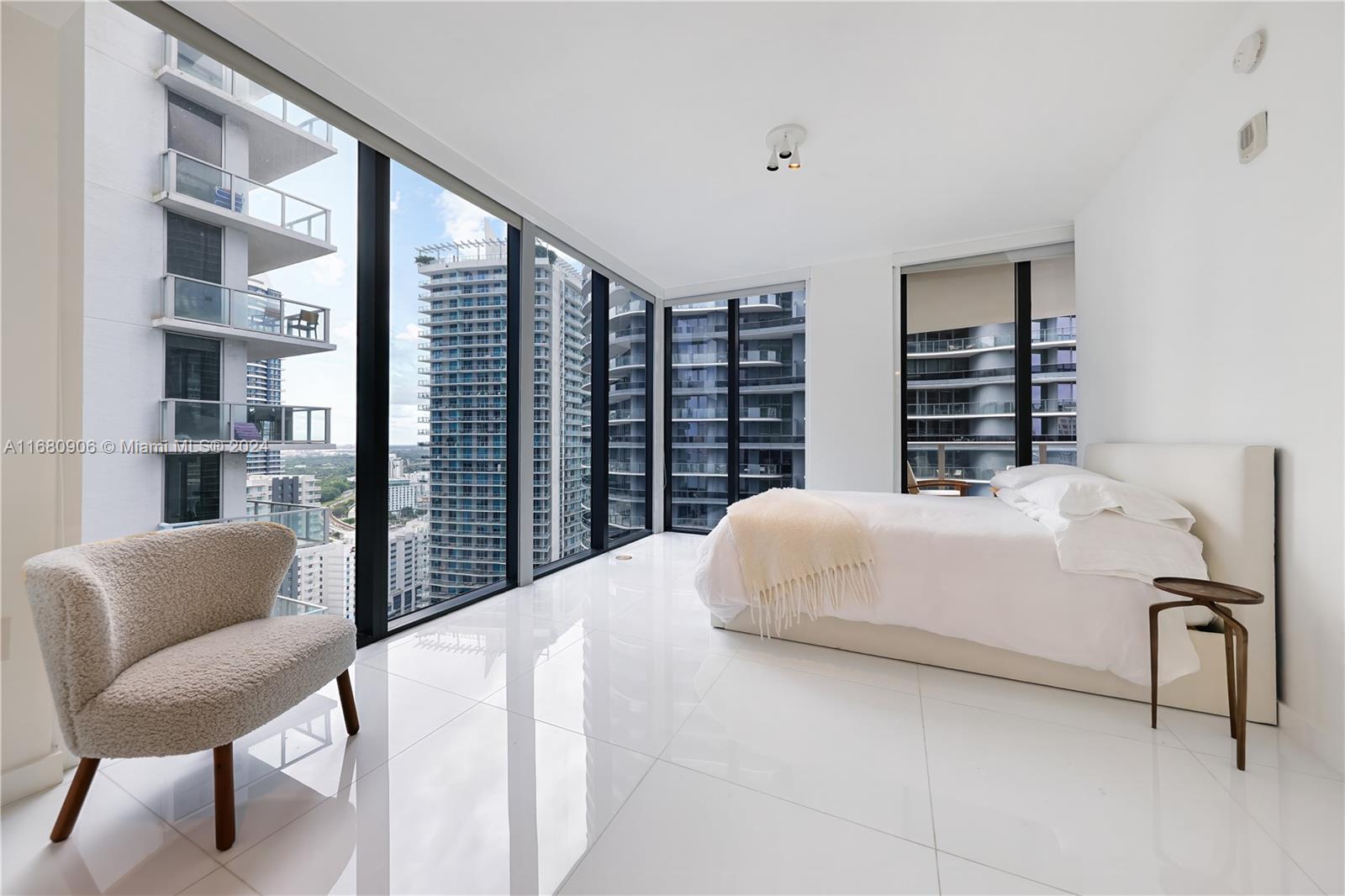 Welcome to luxury living in the vibrant heart of Brickell. This immaculate, 1,100 SF, high-floor unit offers breathtaking city views from the spacious balcony with glass railings. Boasting a split floor plan with two comfortable ensuite bedrooms, this elegant unit features floor-to-ceiling impact glass windows, a gourmet kitchen with stainless steel appliances and European cabinets, and an open-concept living area. 

Located in the heart of Brickell, you will enjoy a wide array of amenities, including a resort-style pool, state-of-the-art fitness center, basketball courts, 24-hour concierge, valet parking, and a breathtaking rooftop pool lounge with panoramic city views. The full-service spa features co-ed hammam, play areas for kids, a virtual golf simulator and so much more.