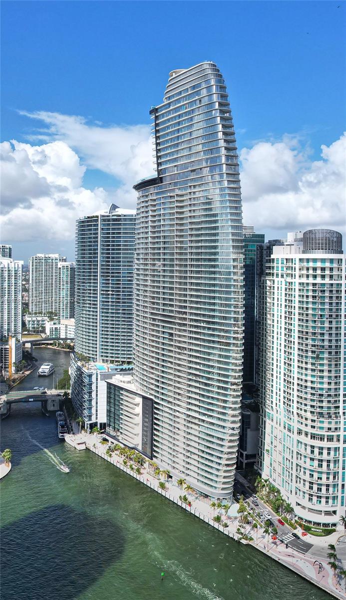 Enjoy the elegance of Aston Martin Residences with panoramic views of Biscayne Bay and iconic Miami skyline. This exquisite 2-bedroom, 2.5-baths condo is bathed in natural light, thanks to its expansive floor-to-ceiling windows, and showcases an open-concept design ideal for both relaxation and entertainment. The state-of-the-art kitchen equipped with premium appliances, flows seamlessly into the living space, creating a perfect harmony of style and function. As a resident, you’ll indulge in world-class amenities—an infinity pool with private cabanas, tranquil spa, cutting-edge fitness center, yoga studio, and even a virtual golf experience. Professionals can take advantage of the business center, conference room and theater. Private yacht marina awaits for your aquatic adventures.