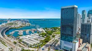 This fully furnished studio on the 43rd floor offers luxury and convenience, featuring a king-size bed, sofa bed, flat-screen TV, and a fully equipped kitchen. It offers stunning views of Miami Beach, Biscayne Bay, and Port Miami. Located in Downtown Miami, it's near Miami International Airport and the Brightline train station, providing easy city access. Flexible rental options (long-term, short-term, or Airbnb) make it an attractive investment. The property includes resort-style amenities such as a cocktail bar, pool, coworking spaces, conference rooms, and a coffee lounge. A prime opportunity to own in a sought-after Miami location.