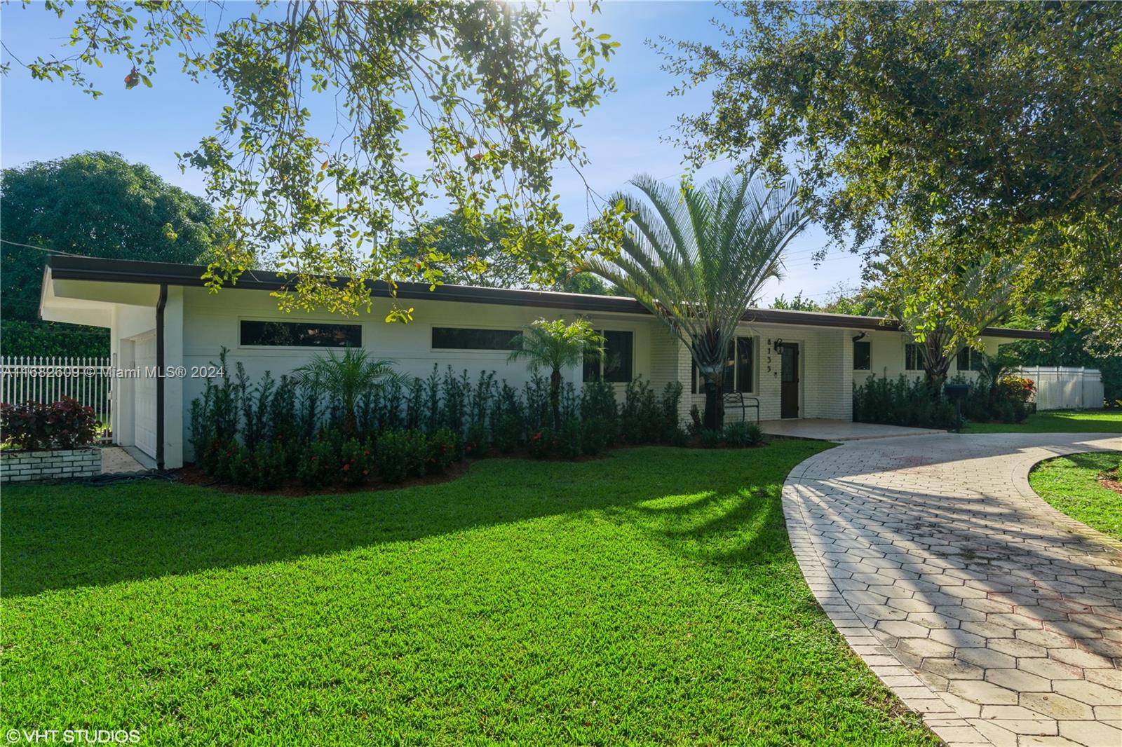 This beautifully renovated 4-bedroom, 2-bathroom home in Pinecrest combines a modern, minimalist design with luxurious features. The living area boasts vaulted wood ceilings, while the spacious covered patio terrace provides the perfect indoor-outdoor entertainment space. Inside, enjoy plush epoxy flooring and a state-of-the-art kitchen with quartz countertops and stainless steel appliances. The inviting 2,382 sq ft layout is situated on a lush, private 16,365 sq ft corner lot with abundant greenery, featuring a circular driveway, additional driveway, and extended 2-car garage.